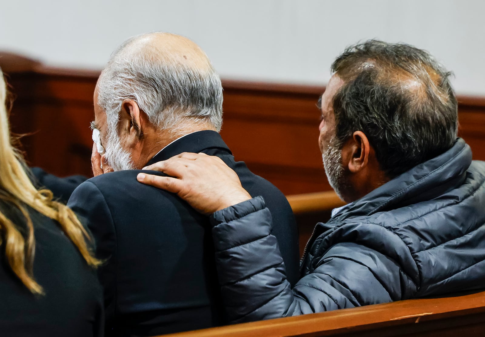 Family members of victims, Ajaib Singh, left, and Nirbhai Singh are filled with emotion as the verdict is read in the retrial of Gurpreet Singh, indicted in the deaths of four family members in 2019 in their West Chester home, Friday, May 10, 2024 in Butler County Common Pleas Court in Hamilton. Singh was found guilty of all counts by a three-judge panel.  NICK GRAHAM/STAFF