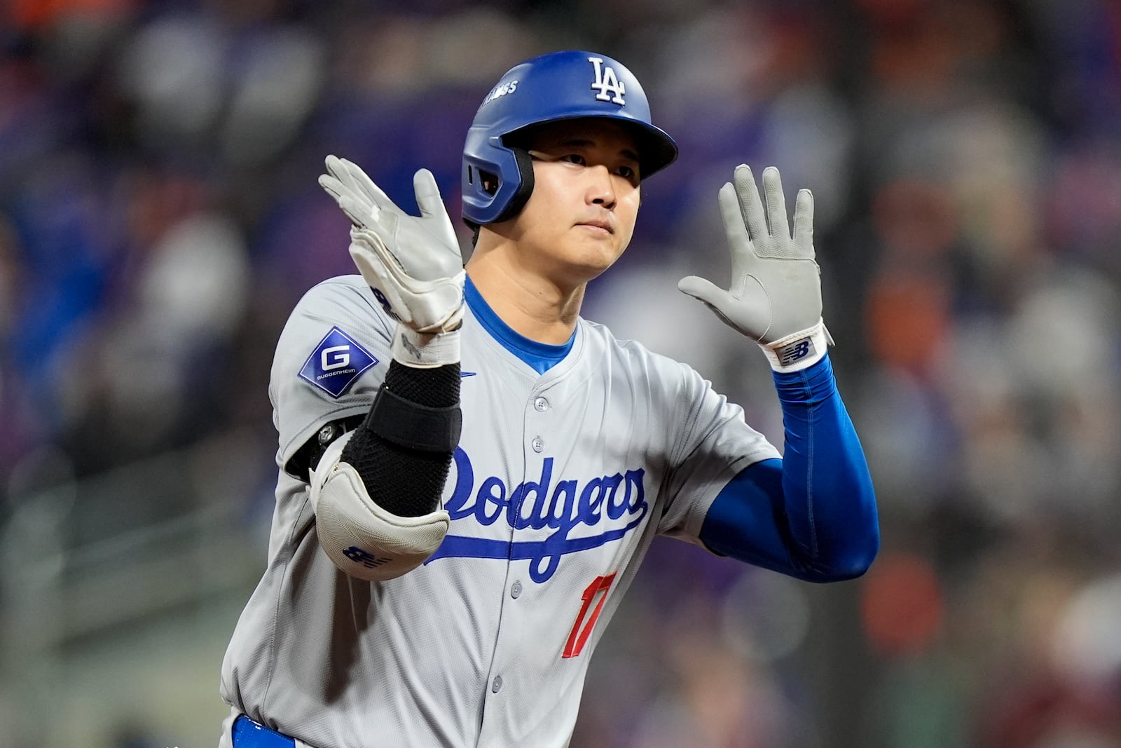 Los Angeles Dodgers' Shohei Ohtani celebrates his three-run home run against the New York Mets during the eighth inning in Game 3 of a baseball NL Championship Series, Wednesday, Oct. 16, 2024, in New York. (AP Photo/Frank Franklin II)