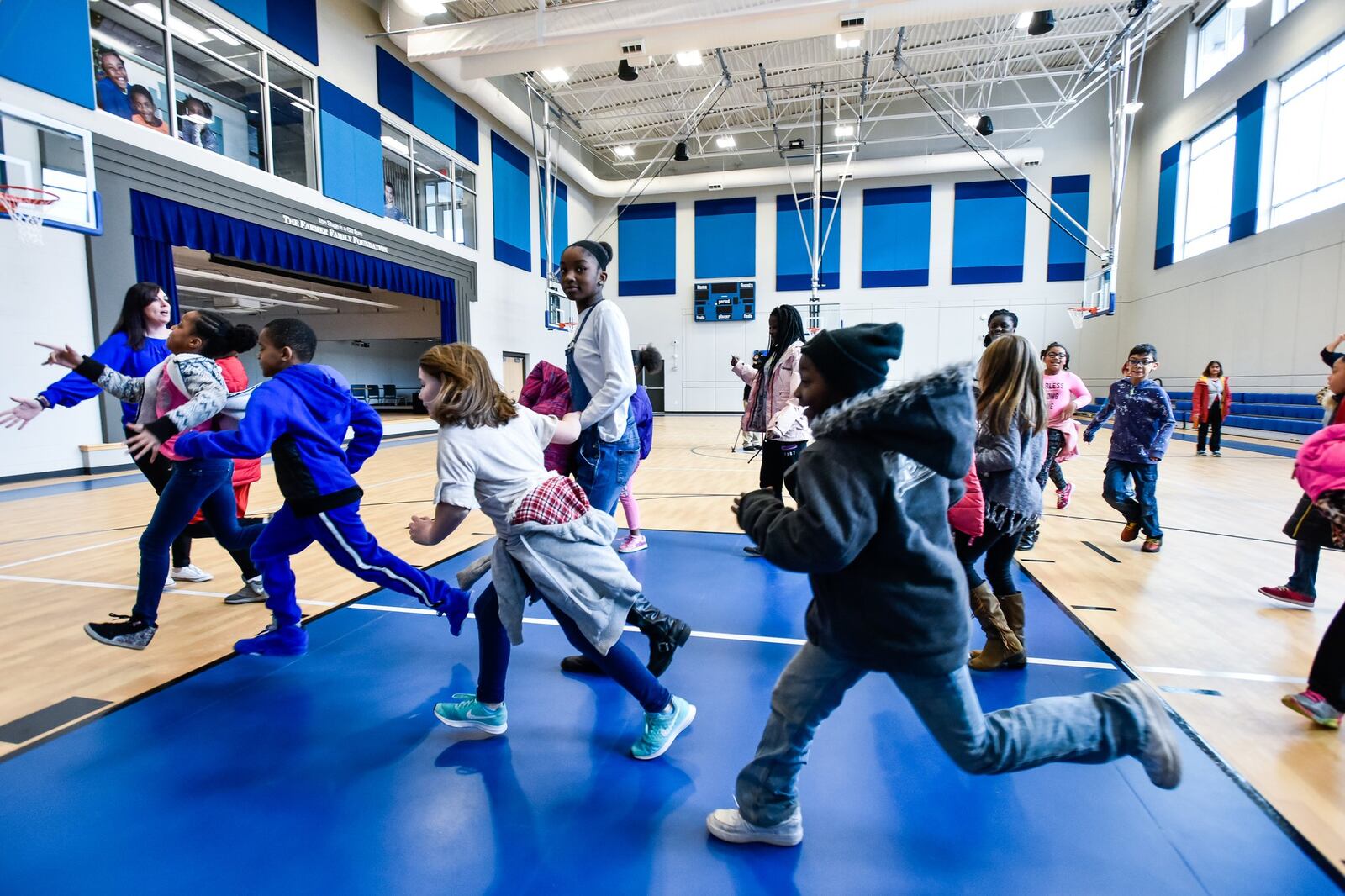 Kids file in to the new Boys and Girls Club of West Chester/Liberty building for a tour Wednesday, Dec. 20. Sixty children took a field trip from the current location to see what they will move in to after the holiday break. NICK GRAHAM/STAFF