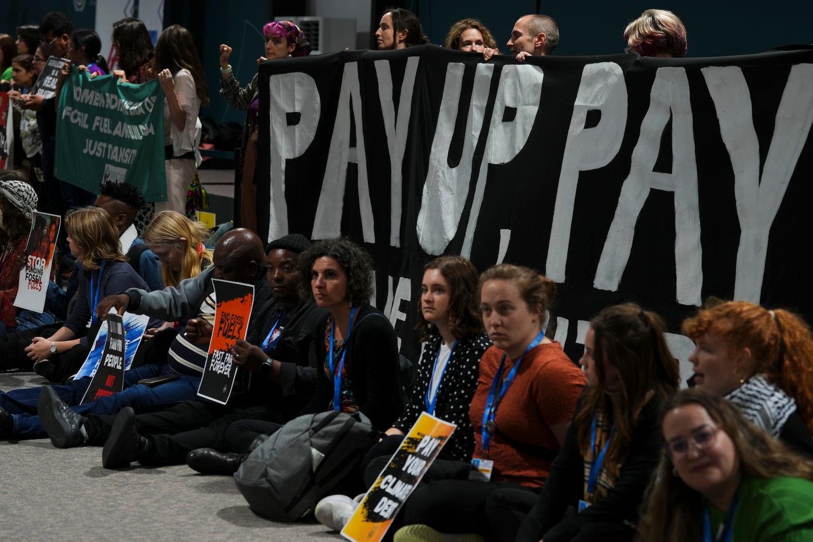 Activists participate in a demonstration for climate finance at the COP29 U.N. Climate Summit, Saturday, Nov. 16, 2024, in Baku, Azerbaijan. (AP Photo/Peter Dejong)