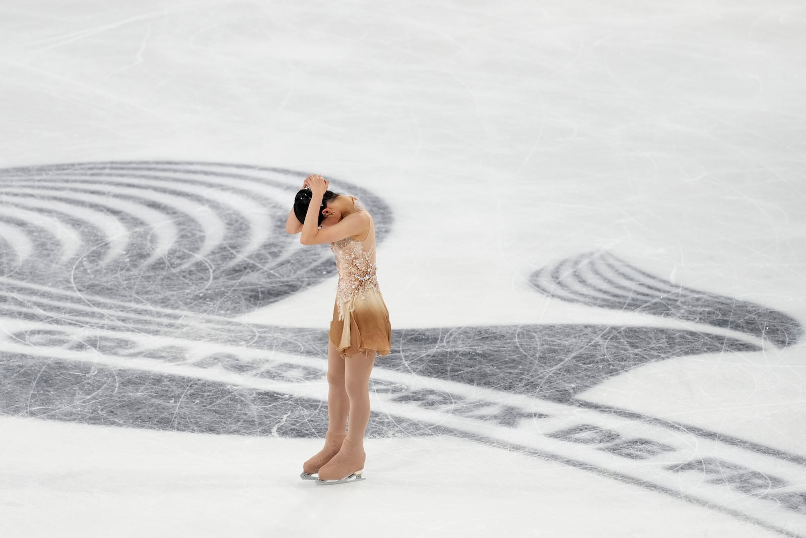 Chaeyeon Kim, of South Korea, reacts after competing in the women's free skating segment at the ISU Grand Prix of Figure Skating, Saturday, Nov. 2, 2024, in Angers, France. (AP Photo/Aurelien Morissard)