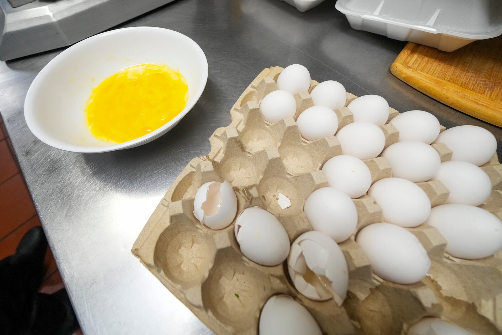 Eggs in a bowl after being cracked during the process of making a fresh omelette at The Breakfast Brothers restaurant, Wednesday, Feb. 12, 2025, in Arlington, Texas. (AP Photo/Julio Cortez)