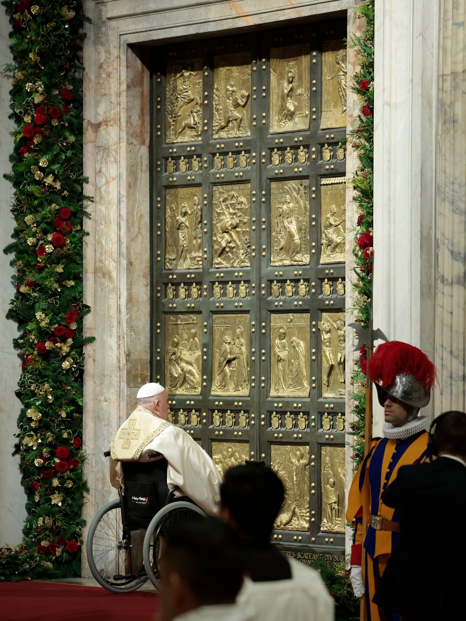 Pope Francis opens the Holy Door to mark the opening of the 2025 Catholic Holy Year, or Jubilee, in St. Peter's Basilica, at the Vatican, Dec. 24, 2024. (Remo Casilli/Pool Photo via AP)