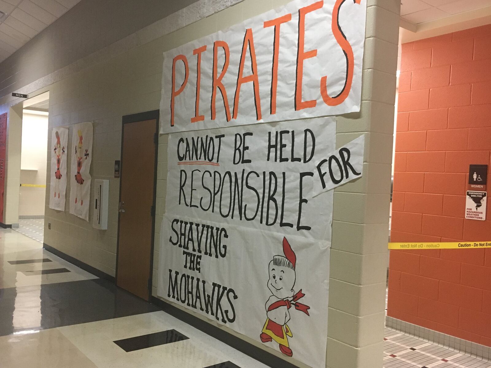 The hallways of Wheelersburg High School are filled with banners and signs in support of the Pirates as they prepare to face Madison in a Division V state semifinal Friday night in Chillicothe. RICK CASSANO/STAFF