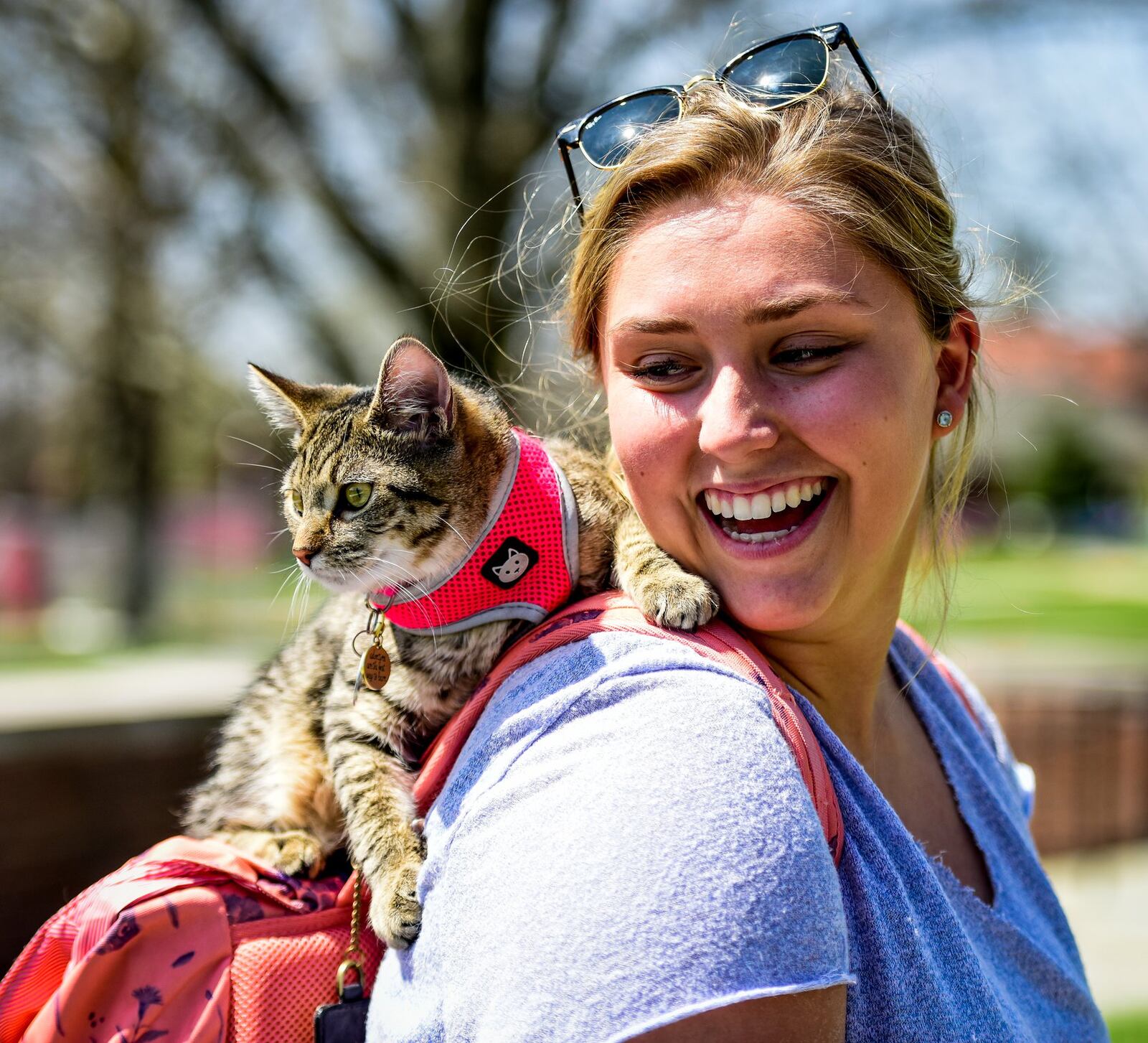 Miami University sophomore Haley Canter stands with her Emotional Support cat, Thea, Wednesday, April 12 on the Miami University Campus in Oxford. 