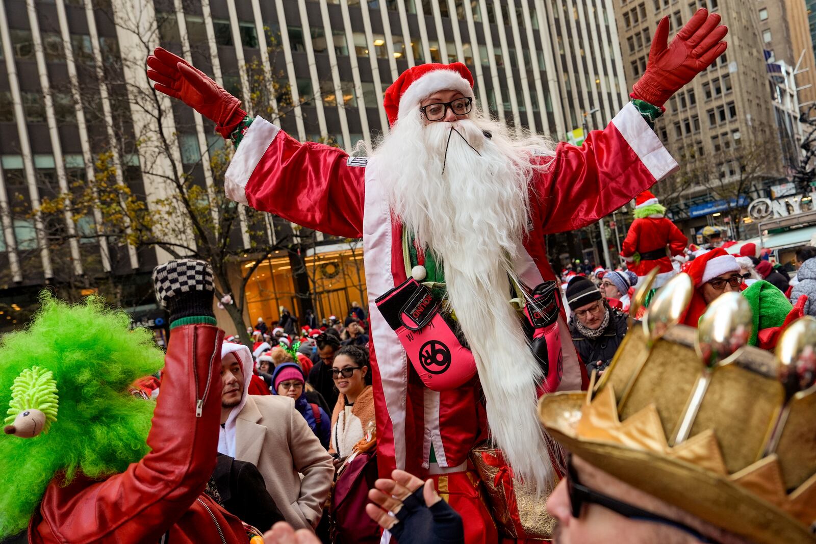 Revellers take part in SantaCon, Saturday, Dec. 14, 2024, in New York. (AP Photo/Julia Demaree Nikhinson)