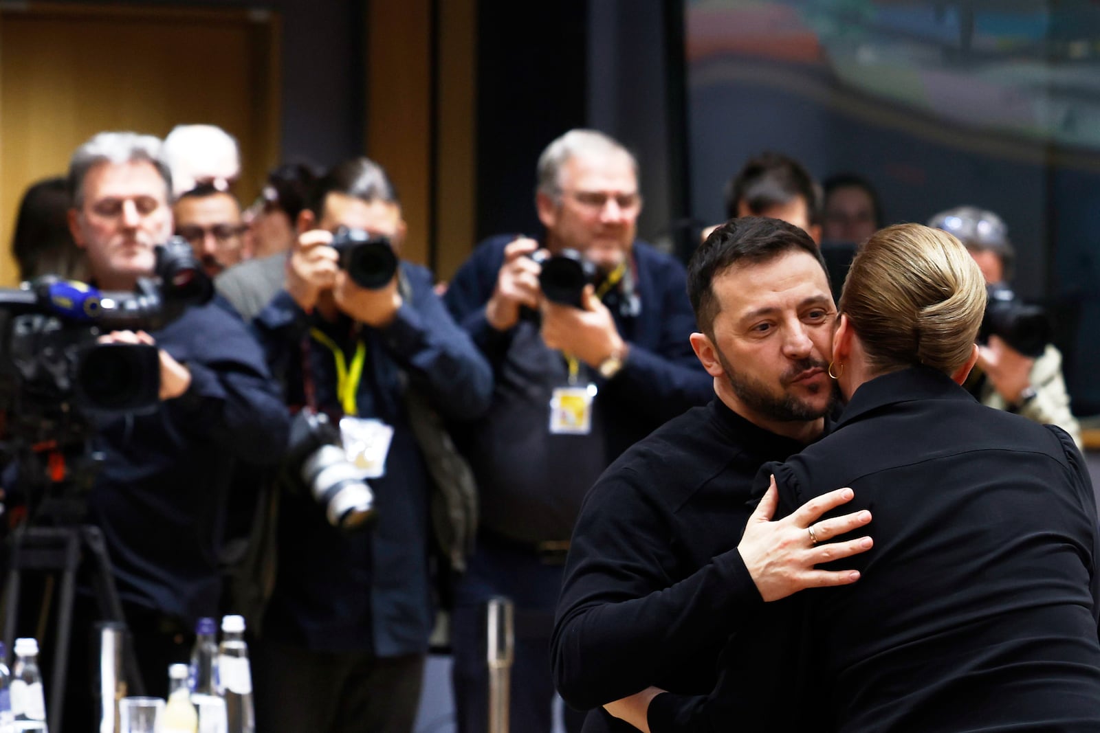 Ukraine's President Volodymyr Zelenskyy, second right, greets Denmark's Prime Minister Mette Frederiksen during a round table meeting at an EU Summit in Brussels, Thursday, March 6, 2025. (AP Photo/Geert Vanden Wijngaert)