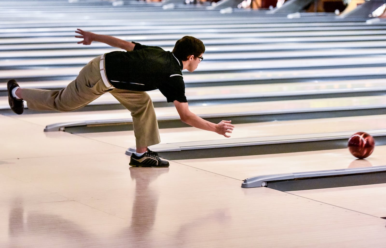 Fenwick’s Kevin Gaston watches his ball head down the lane during Thursday’s Division II district bowling tournament at Beaver-Vu Bowl in Beavercreek. NICK GRAHAM/STAFF