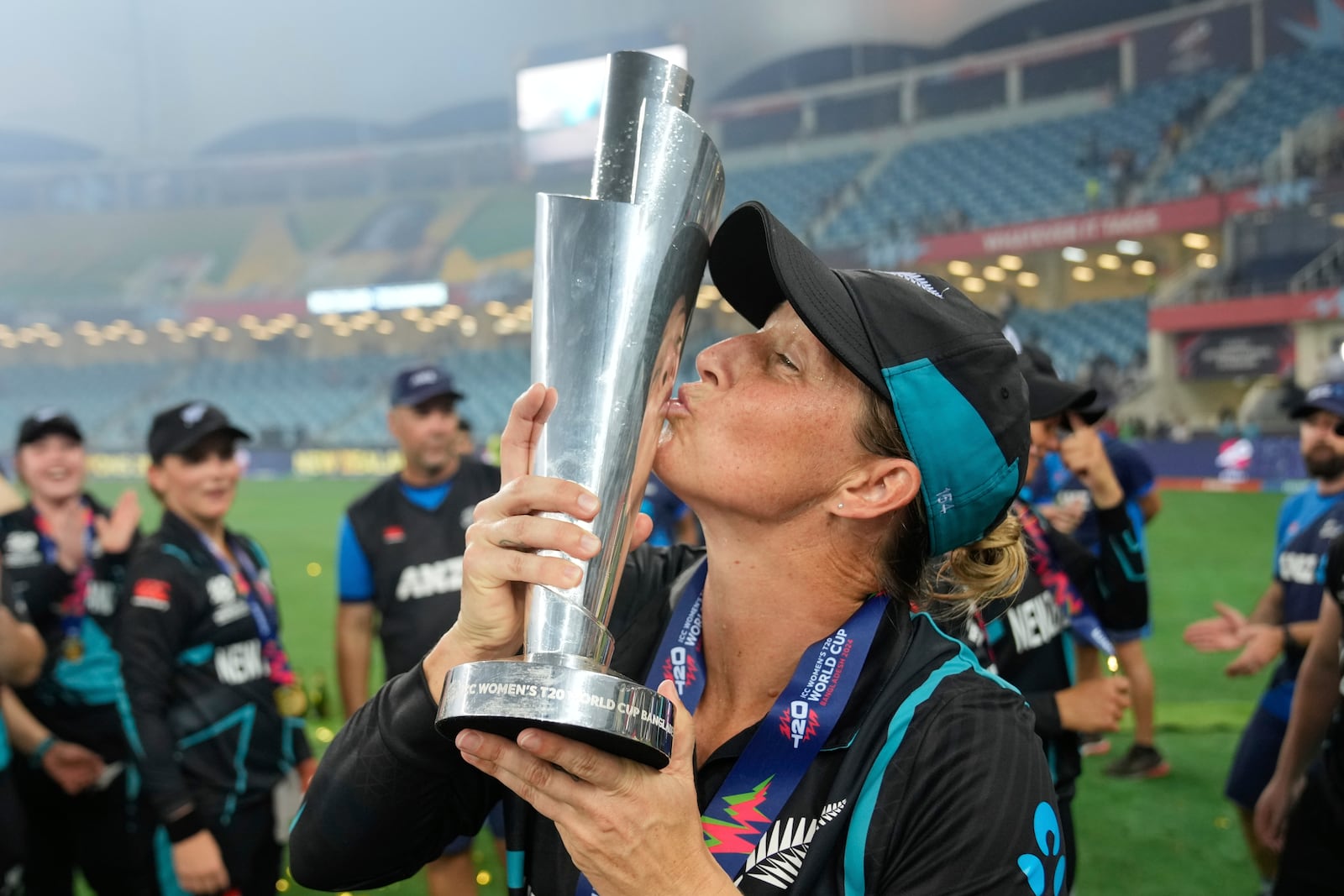 New Zealand's captain Sophie Devine kisses the trophy after winning the ICC Women's T20 World Cup 2024 final match against South Africa at Dubai International Cricket Stadium, United Arab Emirates, Sunday, Oct. 20, 2024. (AP Photo/Altaf Qadri)