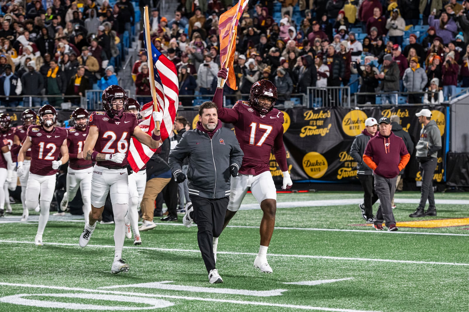 Virginia Tech head coach Brent Pry leads his team onto the field before the first half of an Duke Mayo Bowl game Friday, Jan. 3, 2025, in Blacksburg, Va. (AP Photo/Robert Simmons)