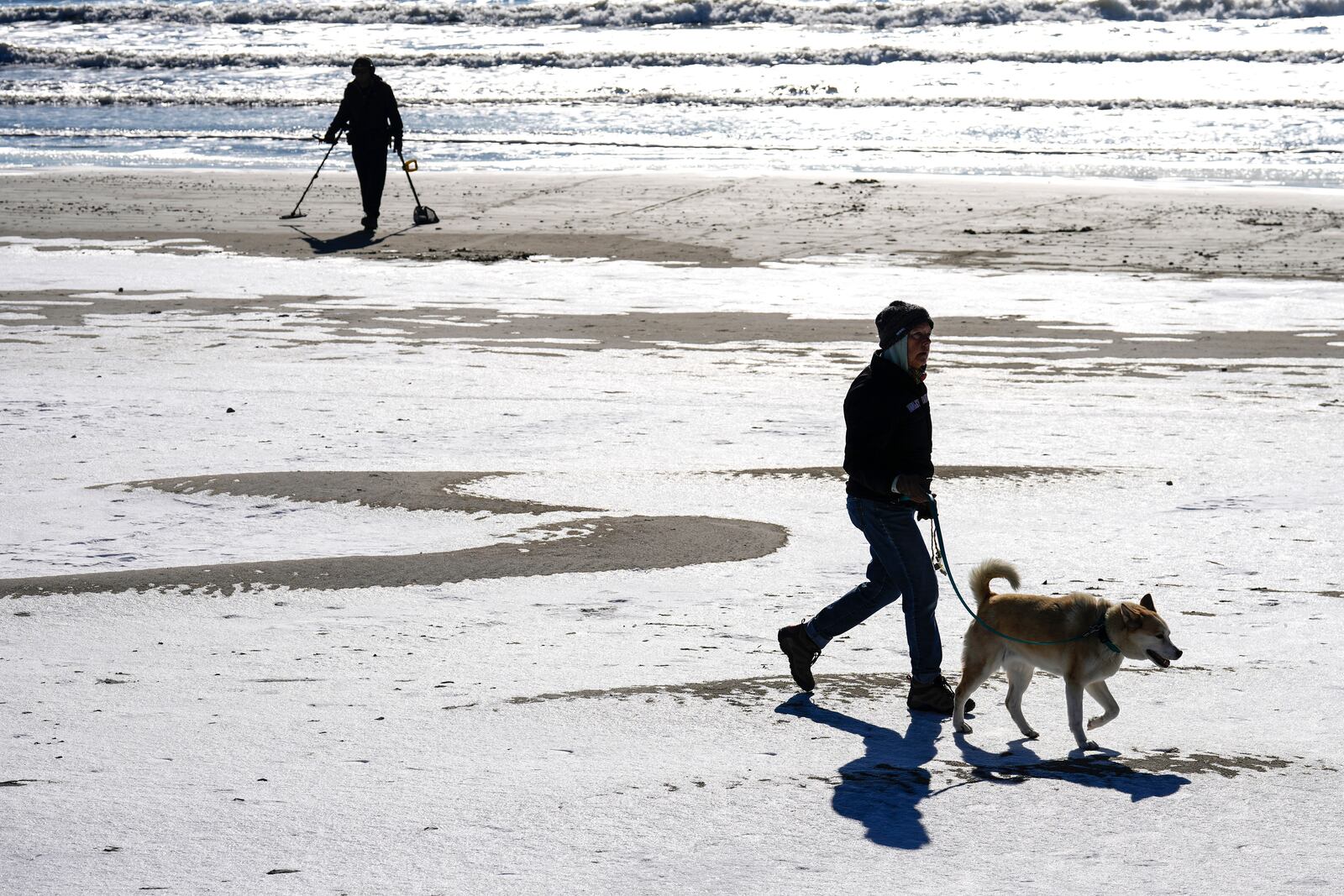 Remnants of melting snow remain on the beach the day after an icy winter storm blanketed the island with a coat of the wintery mix on Wednesday, Jan. 22, 2025 in Galveston, Texas. (Brett Coomer/Houston Chronicle via AP)