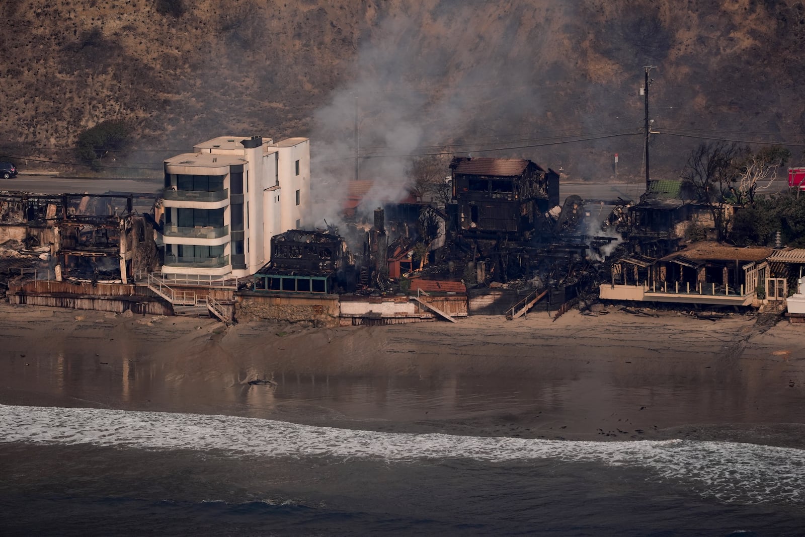 Beachfront properties are left destroyed by the Palisades Fire, in this aerial view, Thursday, Jan. 9, 2025 in Malibu, Calif. (AP Photo/Mark J. Terrill)