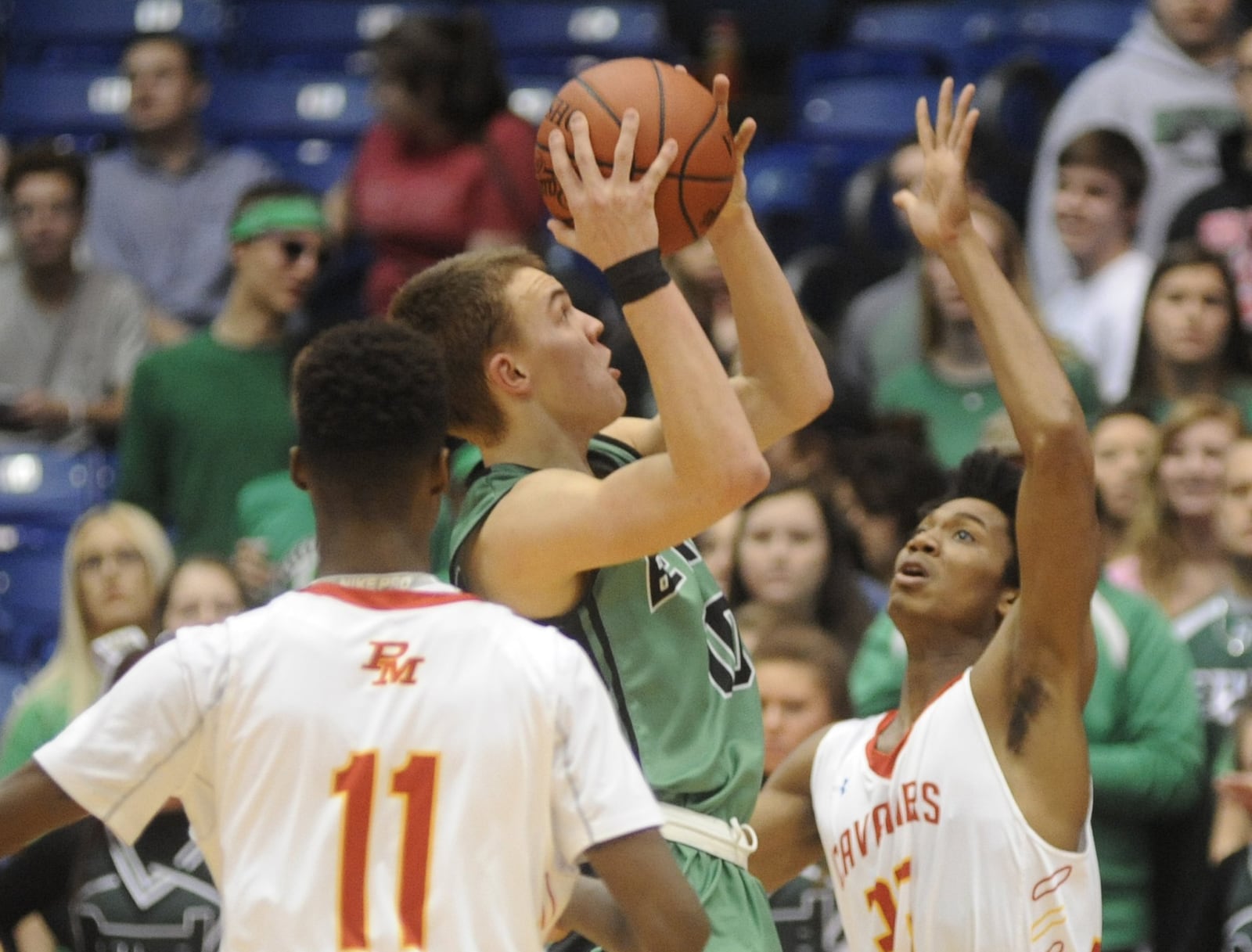 Tipp City Bethel’s Jacob Evans launches a shot during a Division III district final against Purcell Marian on March 2, 2016, at the University of Dayton Arena. Purcell won 60-35. MARC PENDLETON/STAFF