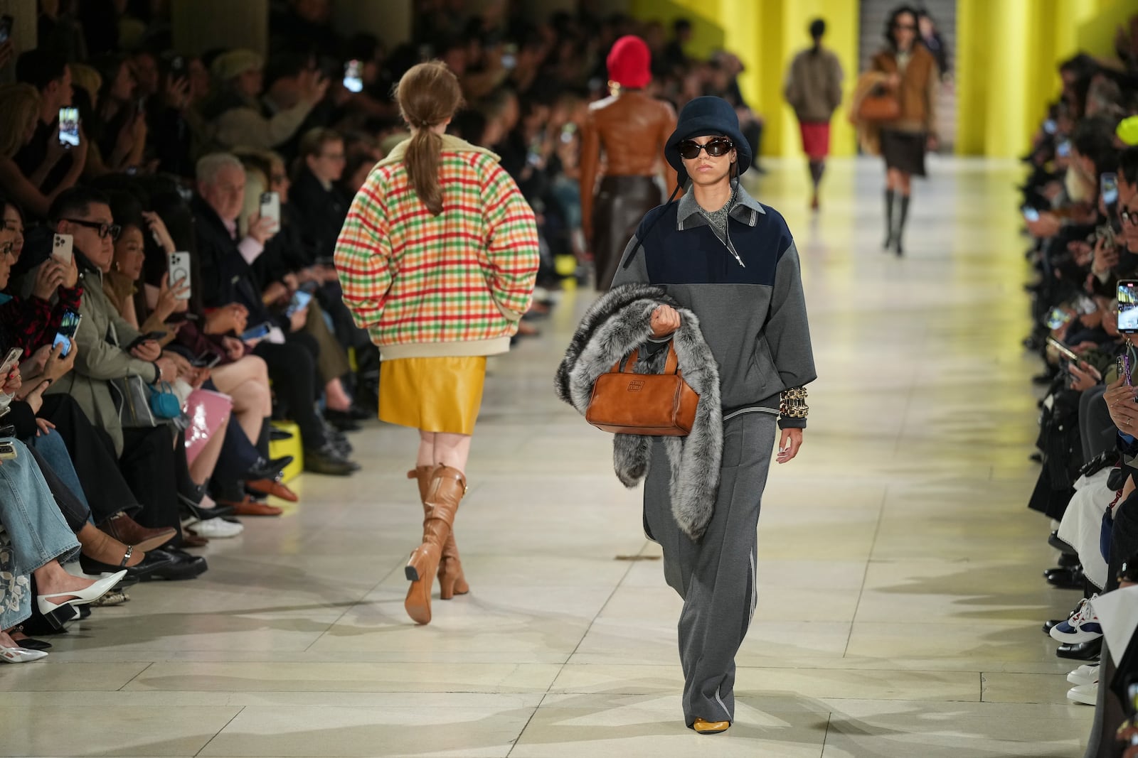 A model wears a creation as part of the Miu Miu Fall/Winter 2025-2026 Womenswear collection presented Tuesday, March 11, 2025. in Paris. (Photo by Scott A Garfitt/Invision/AP)