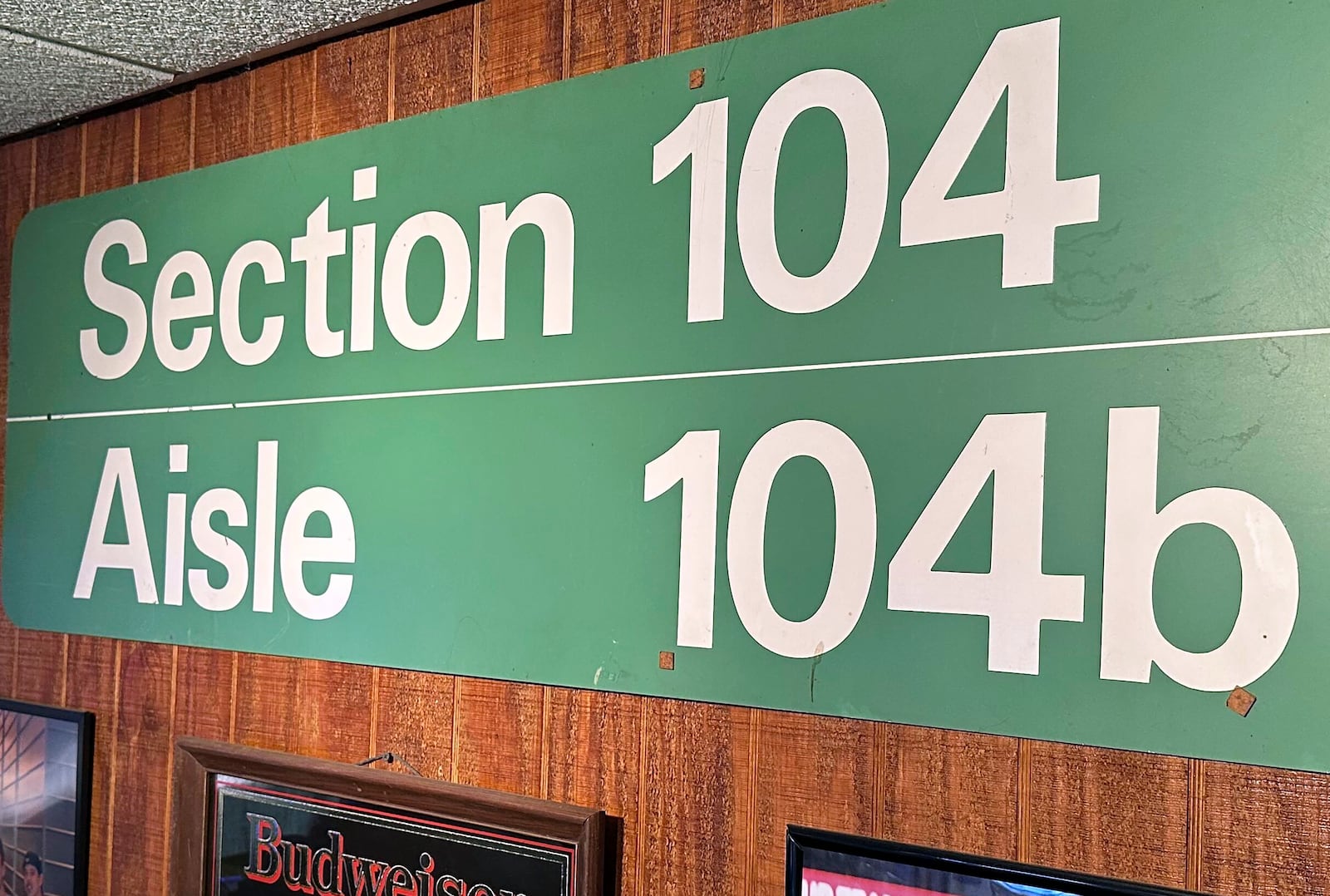 A sign listing the section in which Detroit Lions fan Rob Gonzales once owned season tickets at the Pontiac Silverdome is displayed in the basement of his home Thursday, Jan. 16, 2025, in Frenchtown Township, Mich. (AP Photo/Mike Householder)