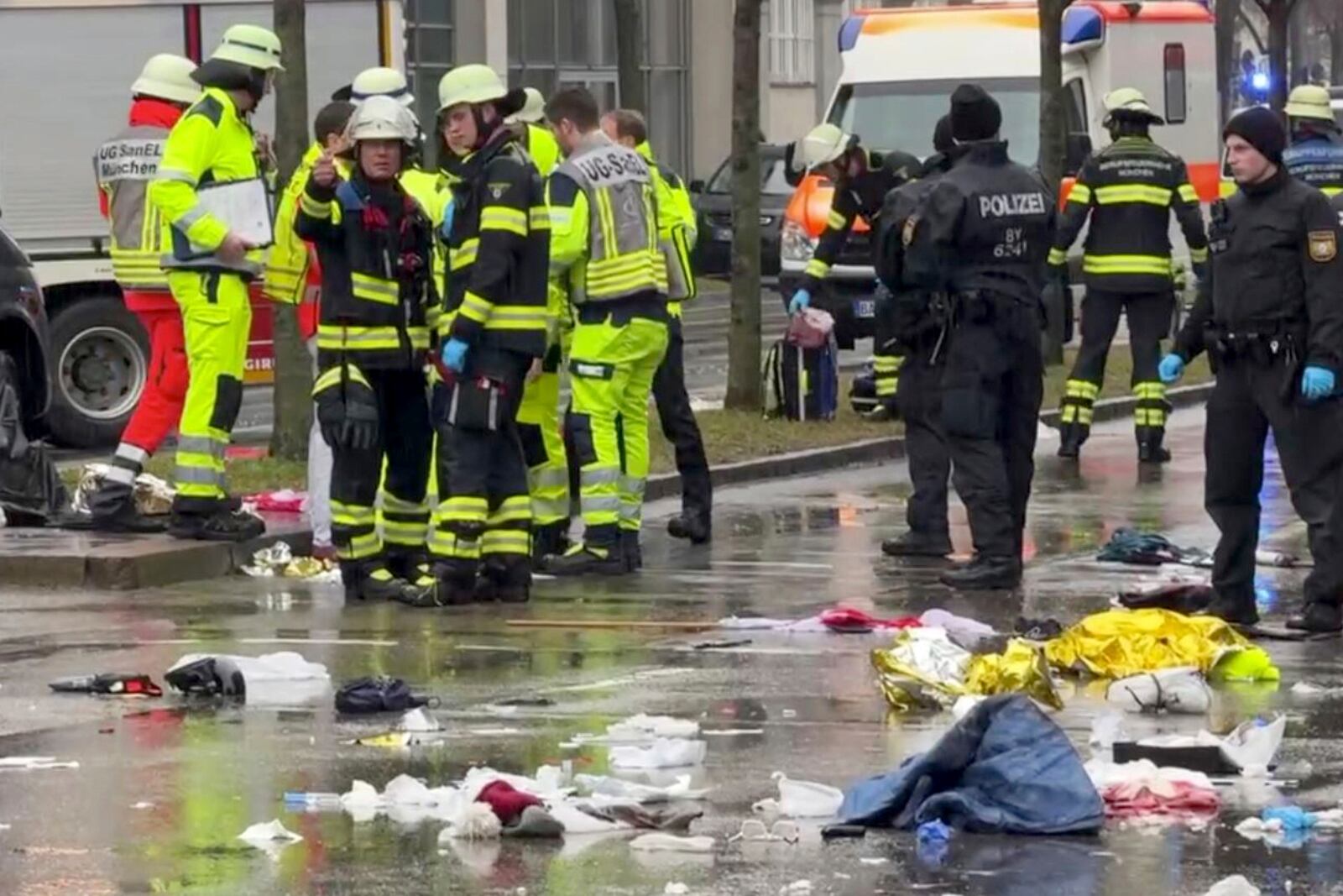 Emergency services attend the scene of an accident after a driver hit a group of people in Munich, Germany, Thursday Feb. 13, 2025. (Peter Kneffel/dpa via AP)