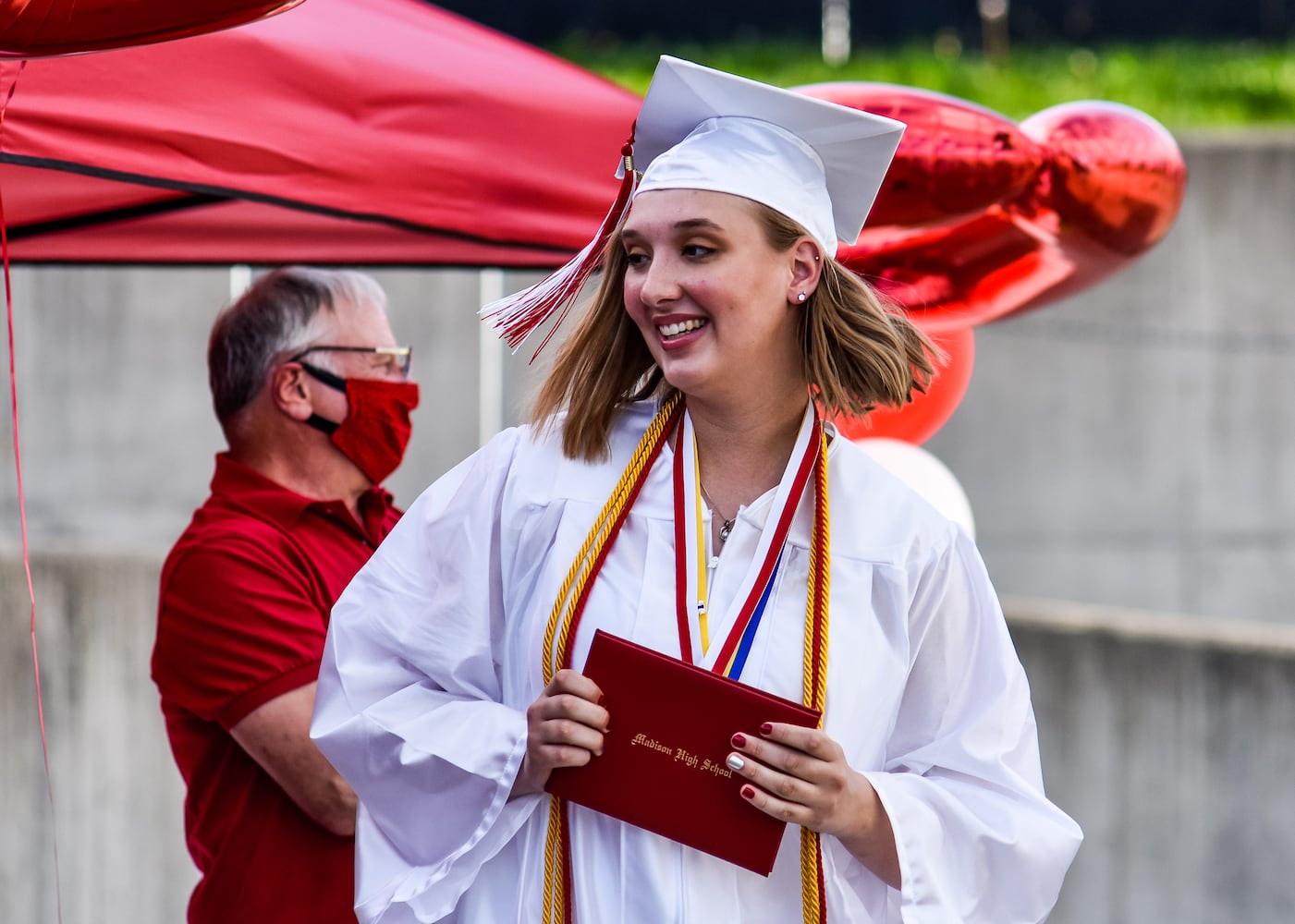 Madison High School drive-thru graduation ceremony at Land of Illusion