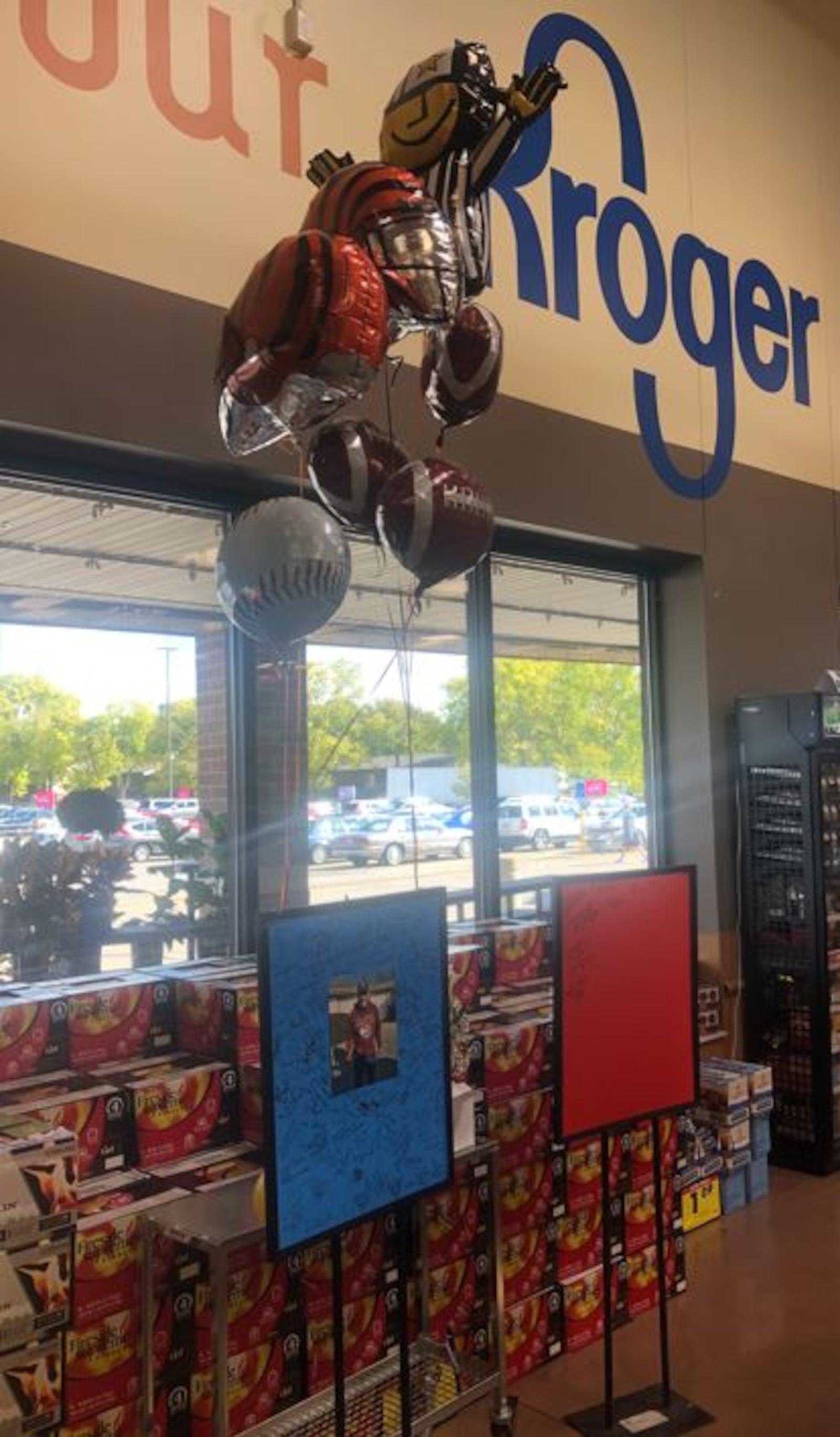 A memorial to David Williams, a longtime Kroger employee, has been signed by customers and employees. RICK McCRABB/STAFF