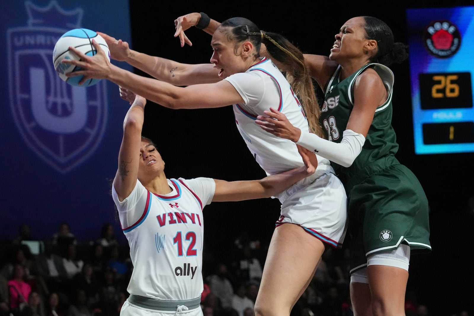 FILE - Vinyl's Dearica Hamby (5) catches a rebound over teammate Rae Burrell, left, and Rose's Azura Stevens (23) during the first half of the 3-on-3 basketball game, Friday, Jan. 17, 2025, in Medley, Fla. (AP Photo/Marta Lavandier, File)