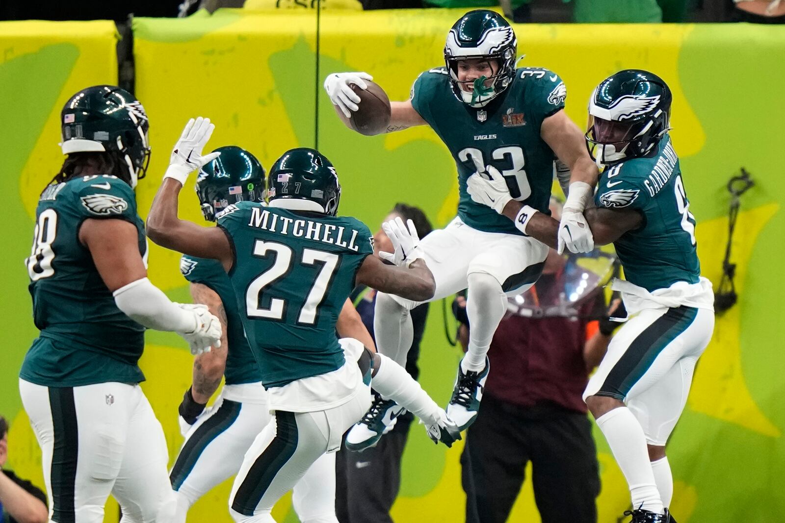 Philadelphia Eagles defensive back Cooper DeJean (33) celebrate his touchdown with safety C.J. Gardner-Johnson (8) after an interception against the Kansas City Chiefs during the first half of the NFL Super Bowl 59 football game, Sunday, Feb. 9, 2025, in New Orleans. (AP Photo/Frank Franklin II)