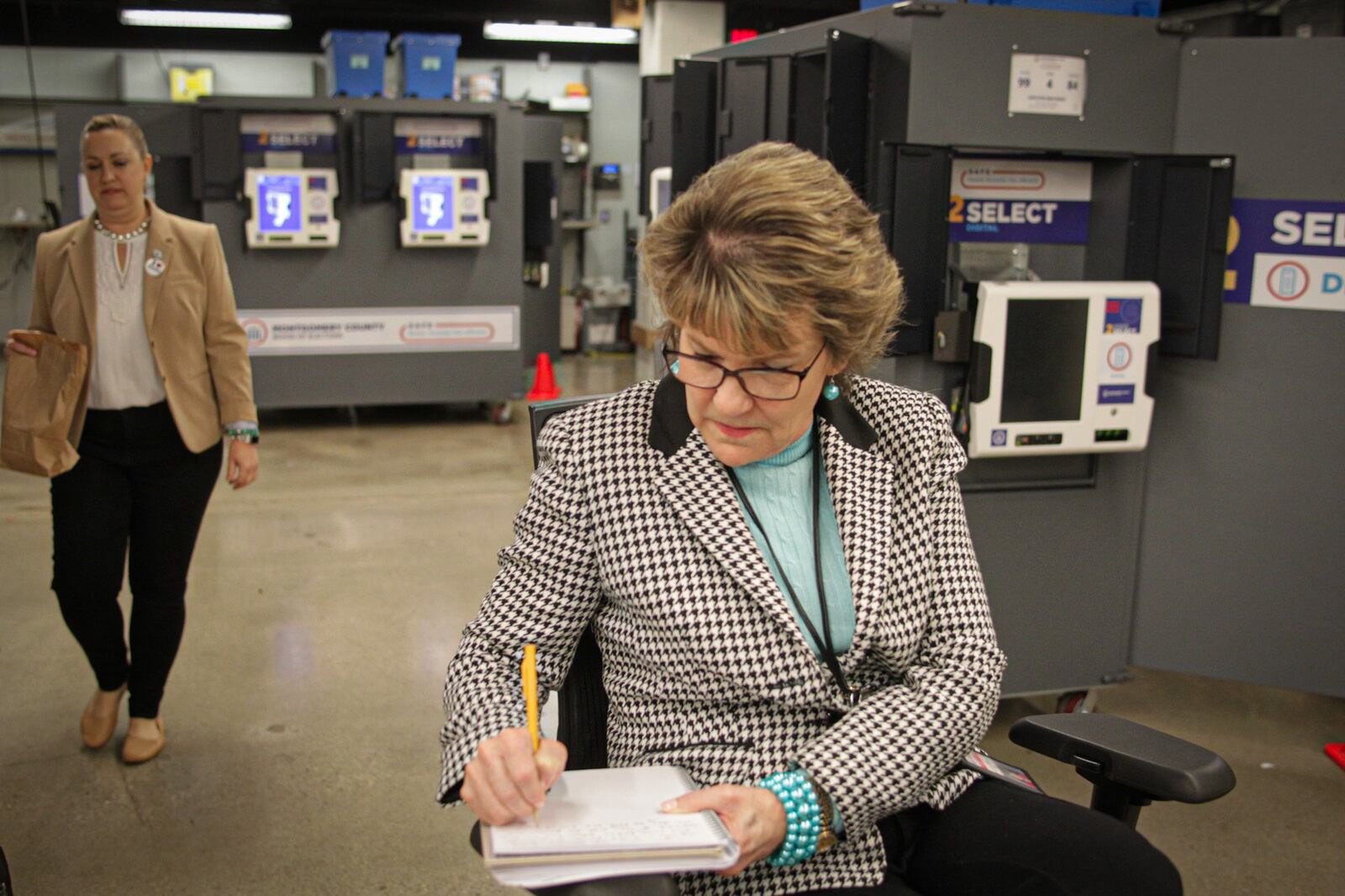 In a file photo taken earlier this year Director of Montgomery County Board of Elections, Jan Kelly, oversees the ballots at  Montgomery County Board of Elections. JIM NOELKER/STAFF