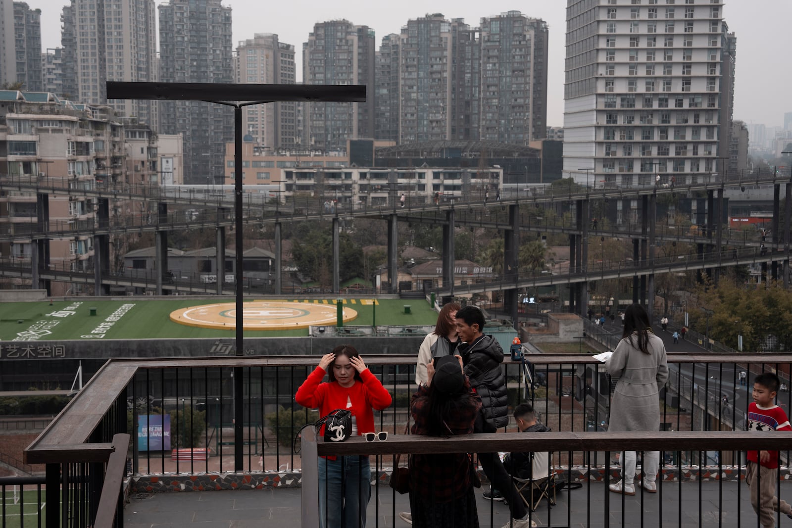 Visitors take in the sight at the West Village project by Pritzker Architecture Prize winner Chinese architect Liu Jiakun in Chengdu in southwestern China's Sichuan province on Sunday, March 2, 2025. (AP Photo/Ng Han Guan)