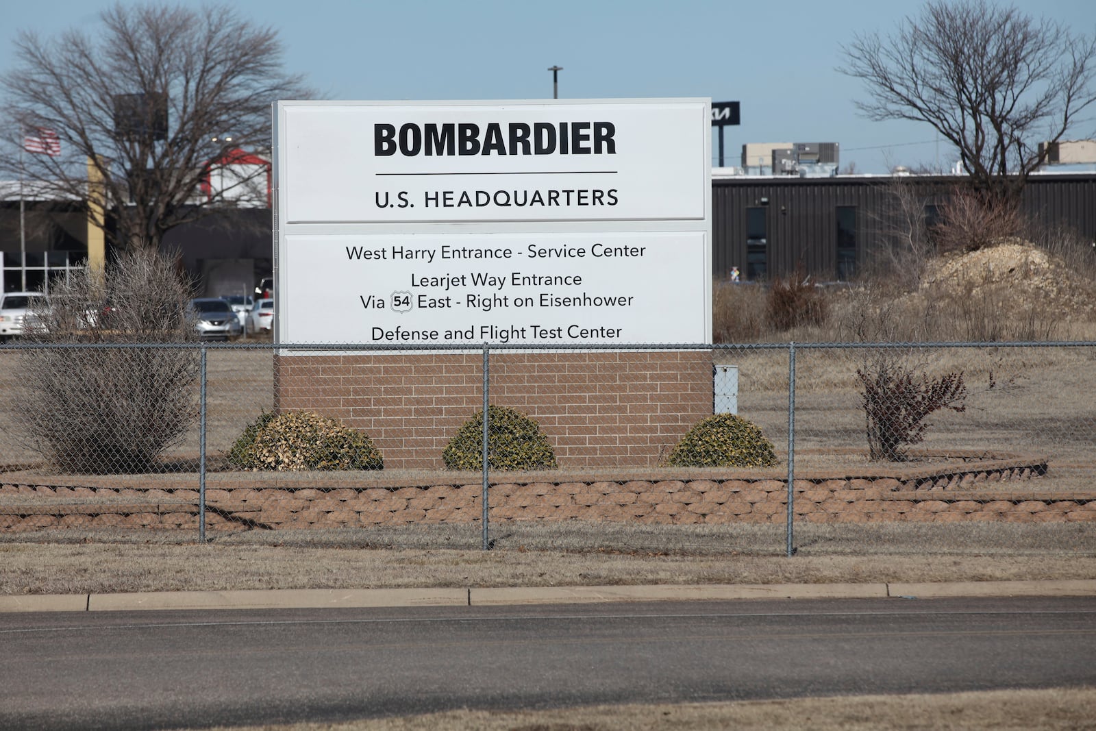 A sign marks an entrance to the U.S. headquarters for aircraft maker Bombardier Inc., Friday, Jan. 31, 2025, in Wichita, Kan. (AP Photo/John Hanna)