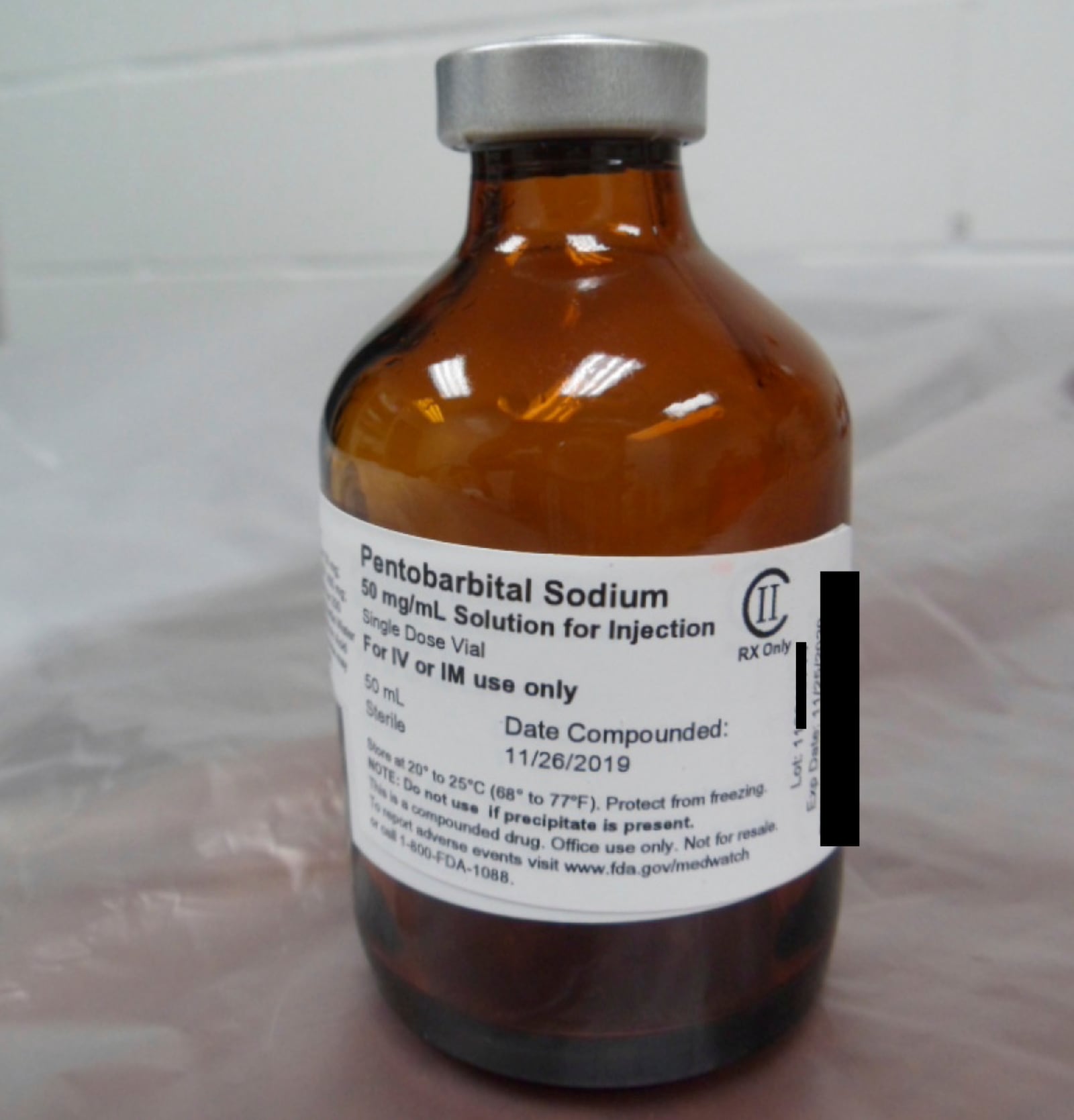 FILE - This photo provided by the U.S. Department of Justice shows a vial of pentobarbital used in the executions of two inmates in July 2020, according to court filings. (Department of Justice via AP, File)