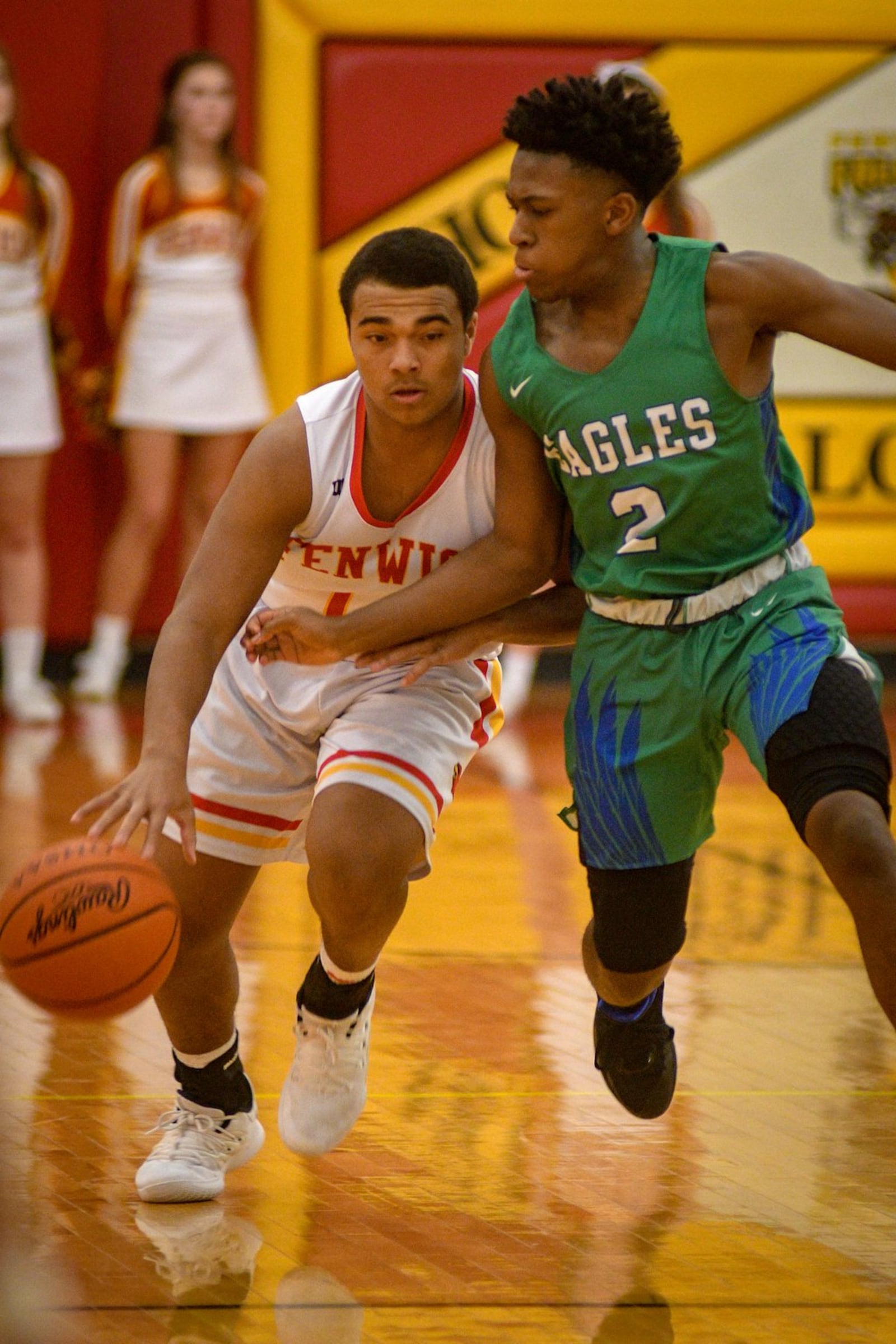 Fenwick’s Jordan Rucker brings the ball up the floor against Chaminade Julienne’s A.J. Solomon (2) on Friday night in Middletown. CJ won 68-63 in double overtime. ROB MCCULLEY/RAM PHOTOGRAPHY