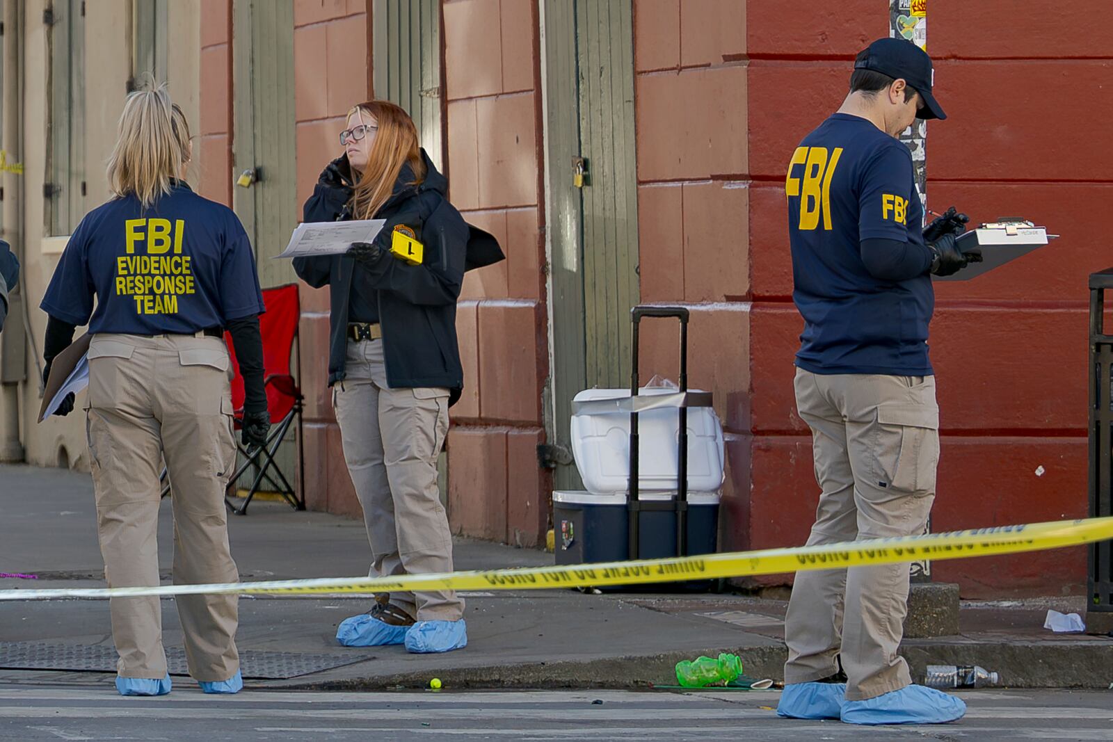 The FBI and a bomb squad earlier detonated a suspicious package found in this cooler at Bourbon St and Orleans Street in the French Quarter during the investigation of truck crashing into pedestrians followed by shooting on Bourbon Street in the French Quarter in New Orleans, Wednesday, Jan. 1, 2025. (AP Photo/Matthew Hinton)