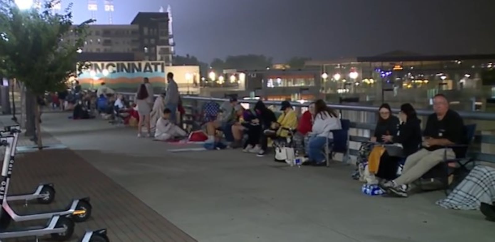 Fans line up at The Banks in downtown Cincinnati Thursday, June 29, 2023 as they await the opening of the Taylor Swift merchandise trailer, which rolled into town on Wednesday. WCPO/CONTRIBUTED