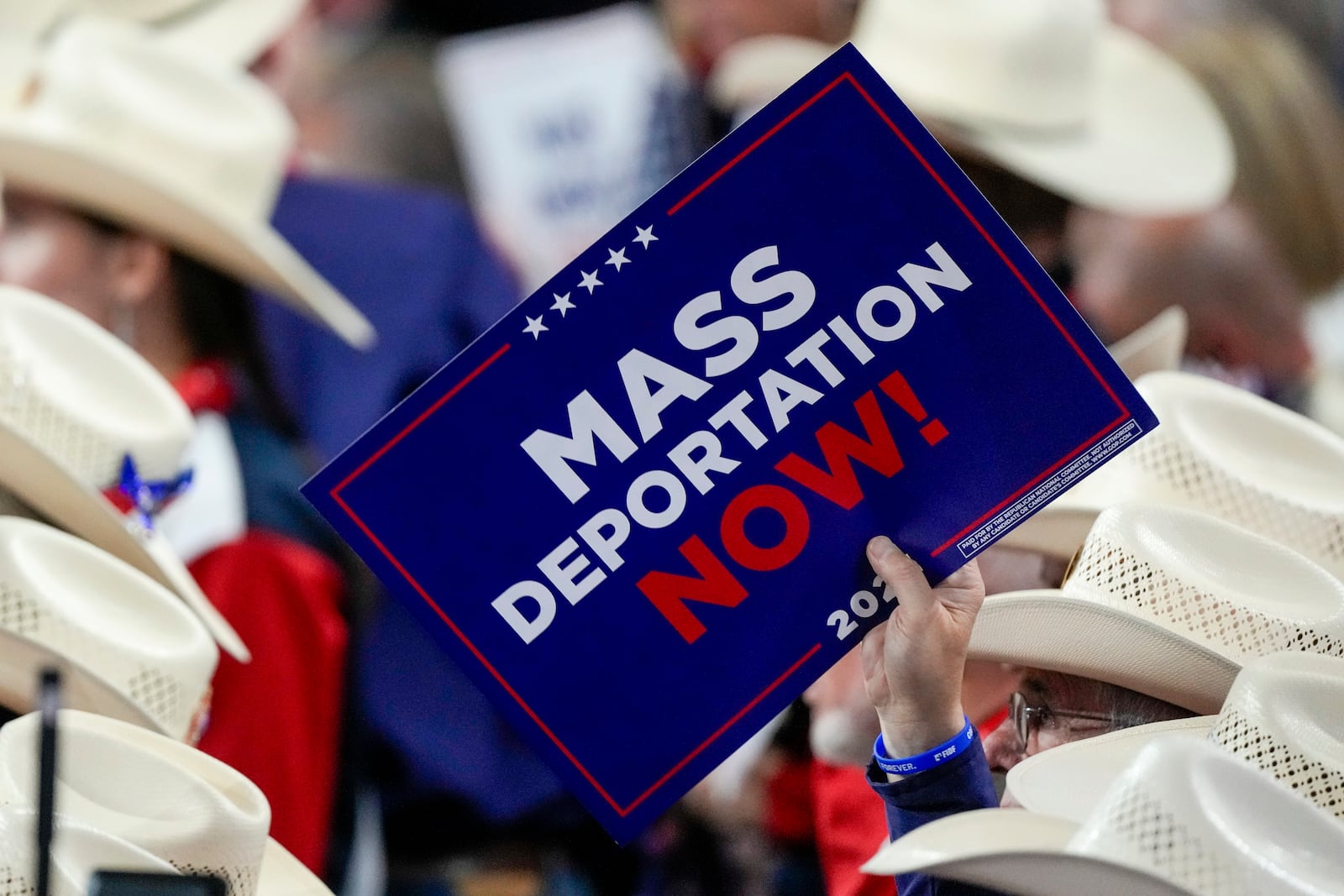 FILE - A member of the Texas delegation holds a sign during the Republican National Convention, July 17, 2024, in Milwaukee. (AP Photo/Matt Rourke, File)