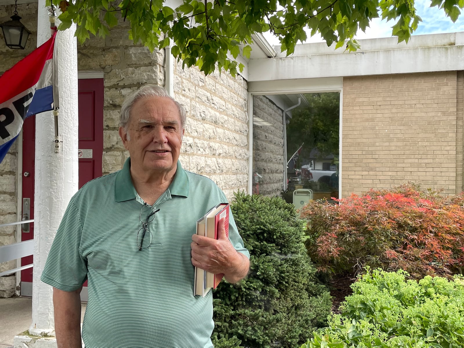 Jerry Hayden, a Bellbrook resident of 20 years, talks about his city's water system while standing in front of the Winters-Bellbrook Community Library.