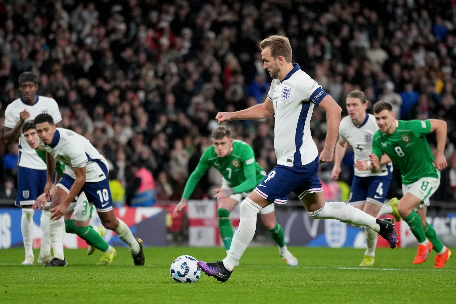 England's Harry Kane scores the opening goal from the penalty spot during the UEFA Nations League soccer match between England and the Republic of Ireland at Wembley stadium in London, Sunday, Nov. 17, 2024. (AP Photo/Kin Cheung)