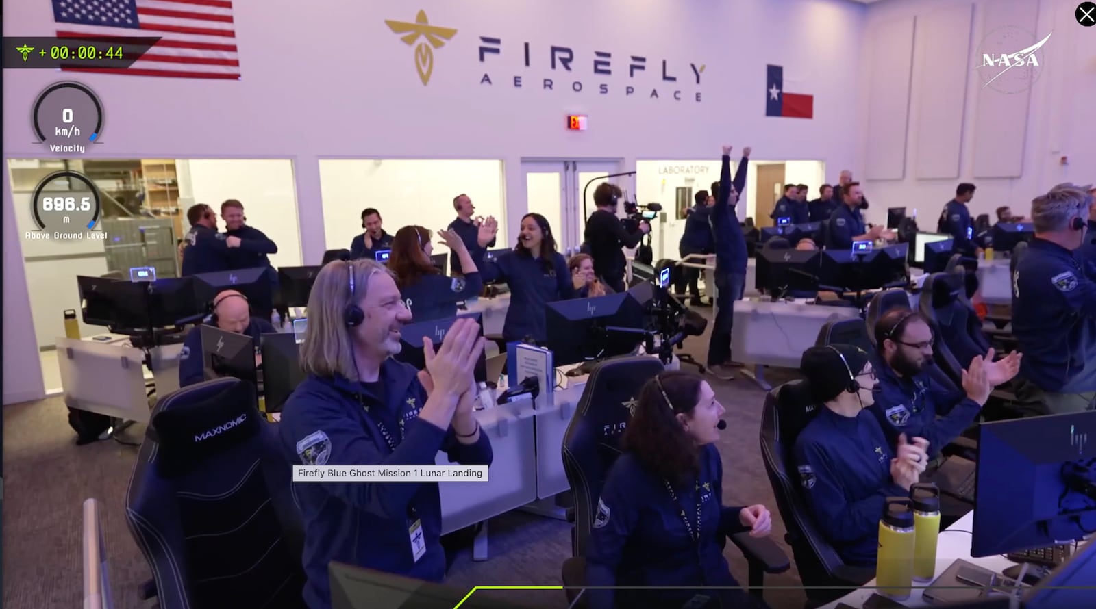 Staff at the Mission Control outside Austin, Texas celebrating as lunar lander Blue Ghost touches down on the moon with a special delivery for NASA, Sunday, March 2, 2025. (NASA/Firefly Aerospace via AP)