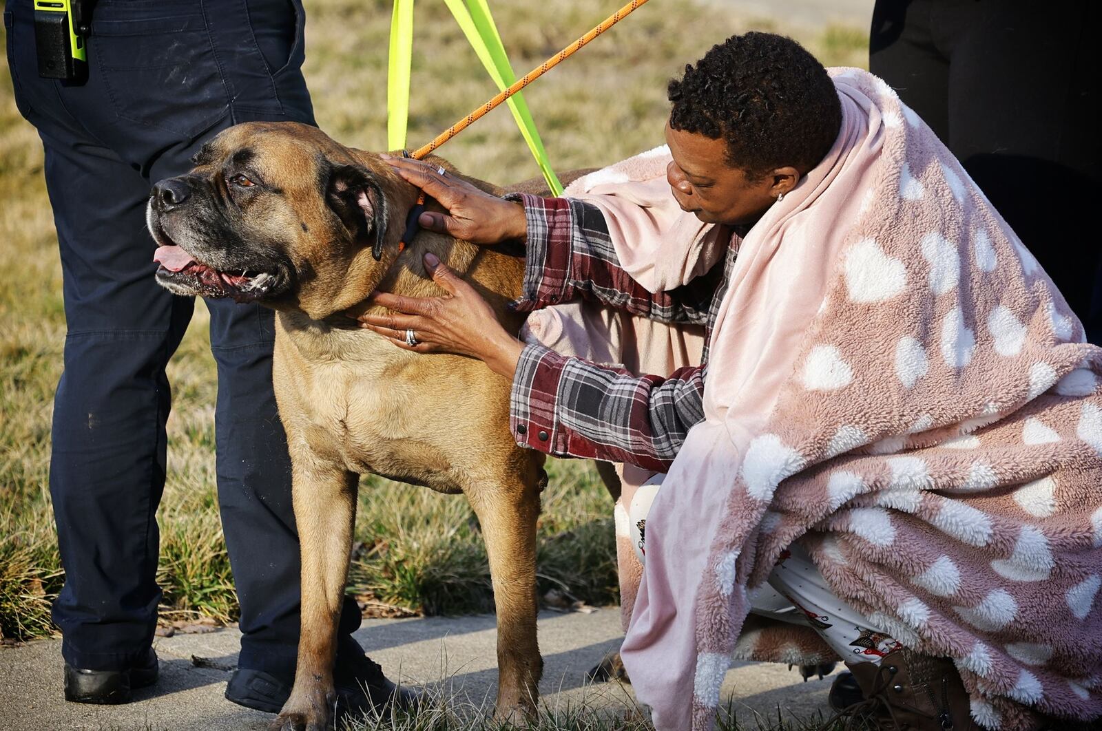 Tamela Devereaux is reunited with her dog Apollo who was rescued from a house fire Feb. 23, 2024, on Marcia Drive in Trenton. NICK GRAHAM/STAFF