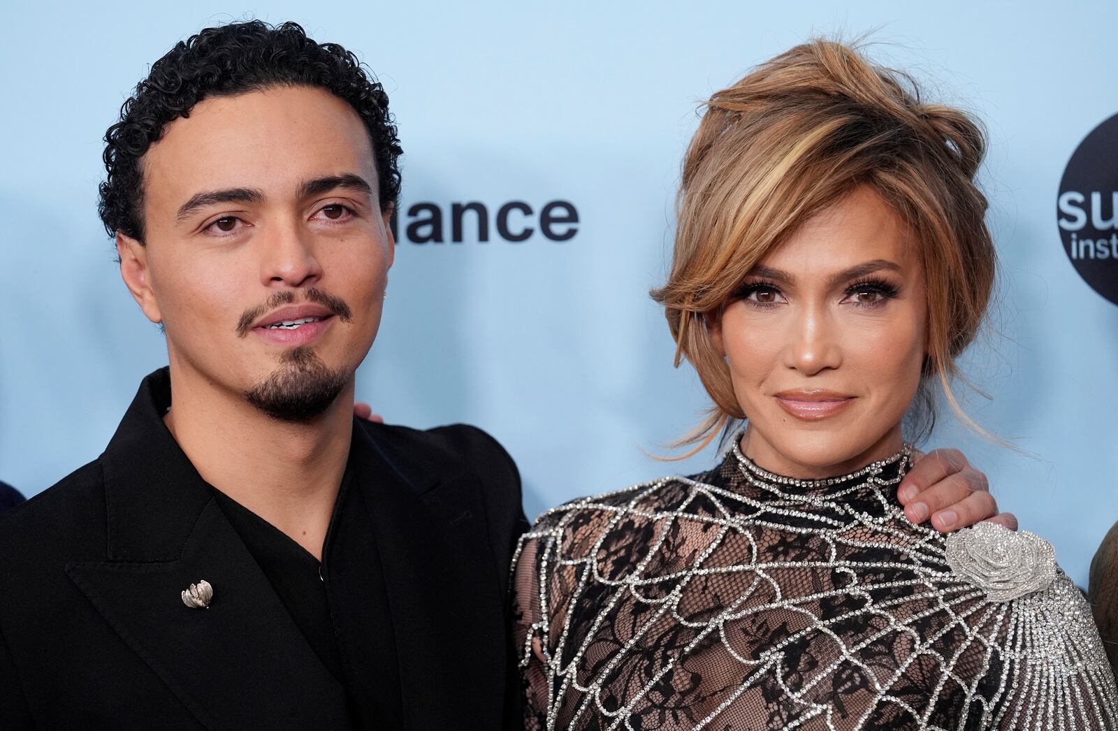 Jennifer Lopez, right, and Tonatiuh, cast members in "Kiss of the Spider Woman," pose together at the premiere of the film during the Sundance Film Festival on Sunday, Jan. 26, 2025, in Park City, Utah. (AP Photo/Chris Pizzello)