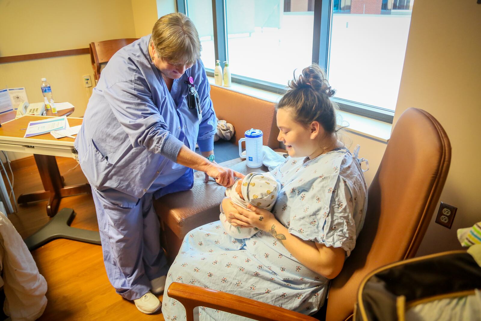 Tracy Justice, a lactation consultant at Atrium Medical Center, talks with new mother, Barbara Jones in November 2016. 