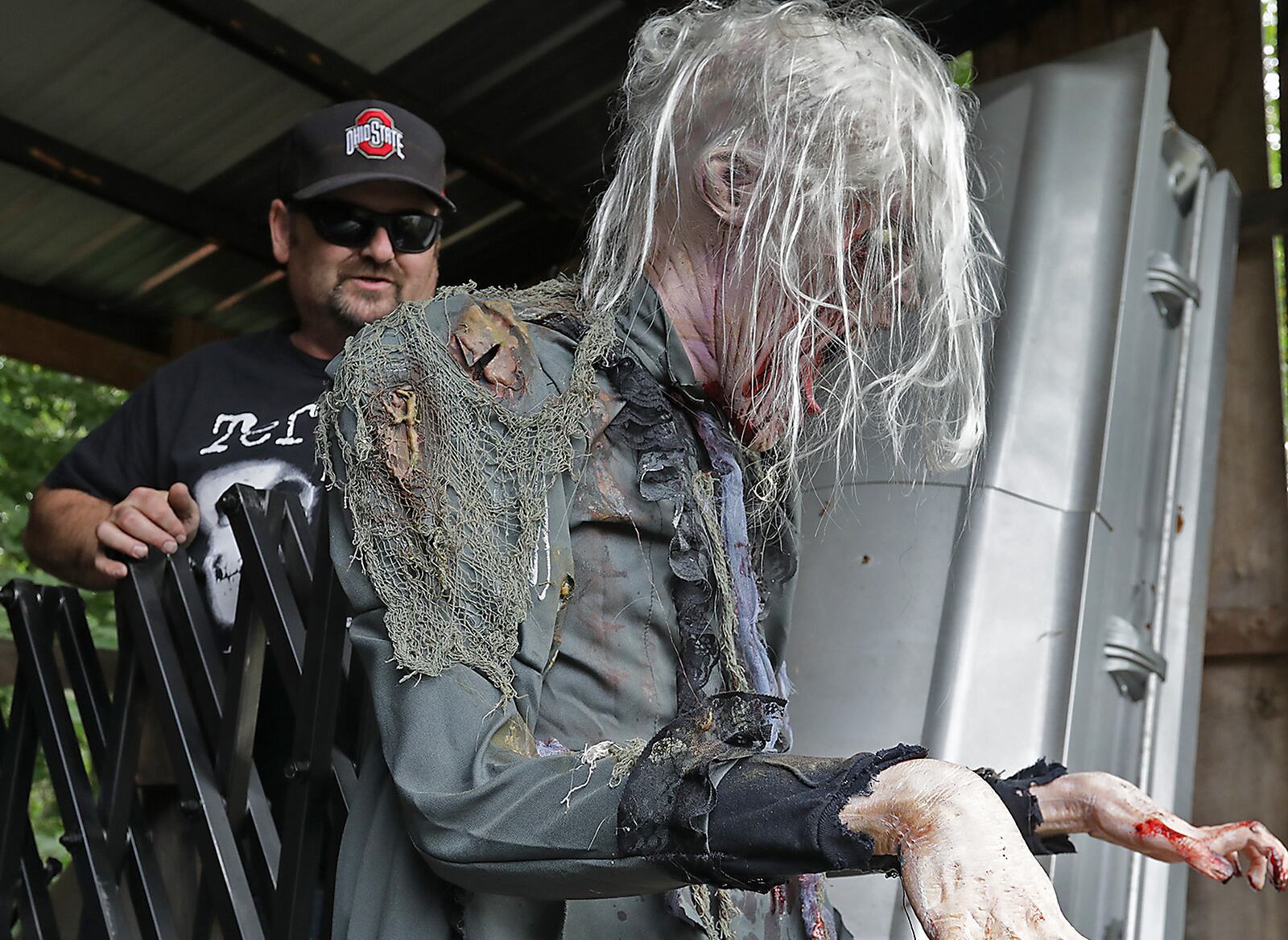 Paul Deady sets up an animatronic figure as he works on the Terror Maze. BILL LACKEY/STAFF