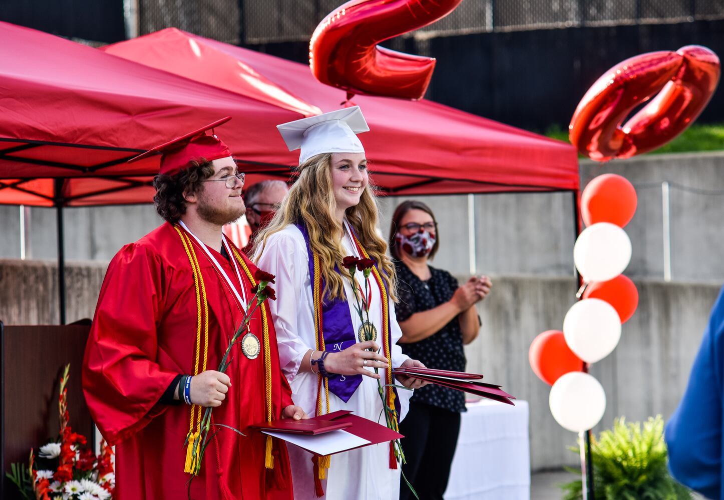 Madison High School drive-thru graduation ceremony at Land of Illusion