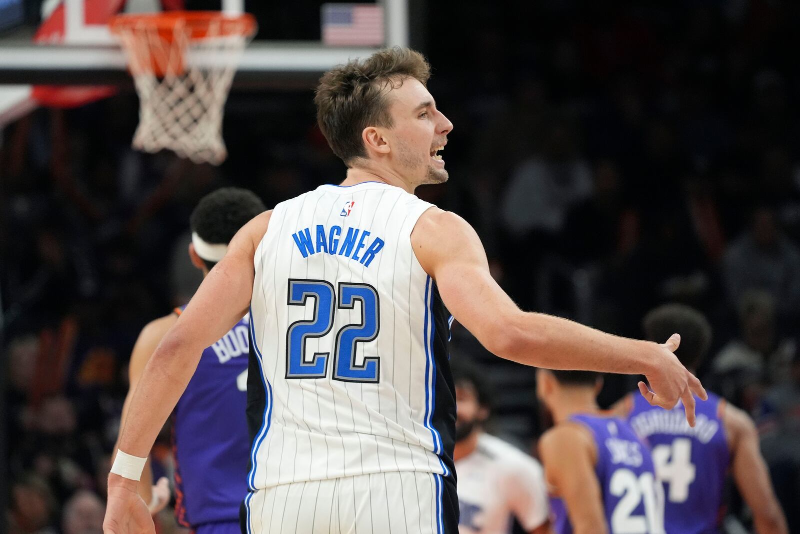 Orlando Magic forward Franz Wagner celebrates a made 3-point basket against the Phoenix Suns during the second half of an NBA basketball game Monday, Nov. 18, 2024, in Phoenix. (AP Photo/Ross D. Franklin)