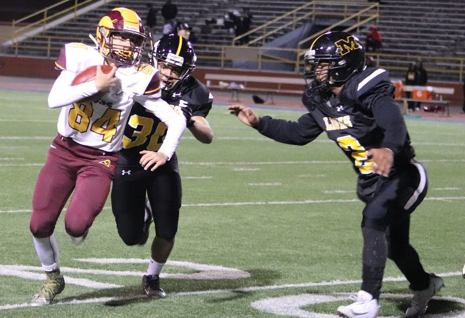 Ross quarterback Brayden Fraasman (84) gets around the edge during Thursday’s night’s 52-6 win over Meadowdale at Welcome Stadium in Dayton. CONTRIBUTED PHOTO BY KAREN REDEMEIER