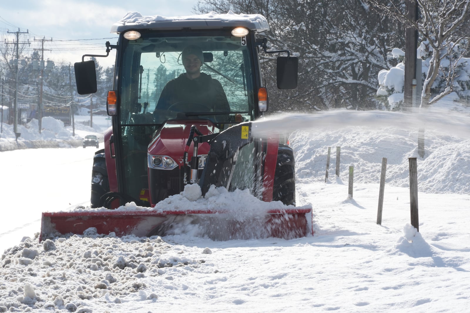 A man clears a path through the snow in Elma, N.Y., Monday, Dec. 2, 2024. (AP Photo/Gene J. Puskar)