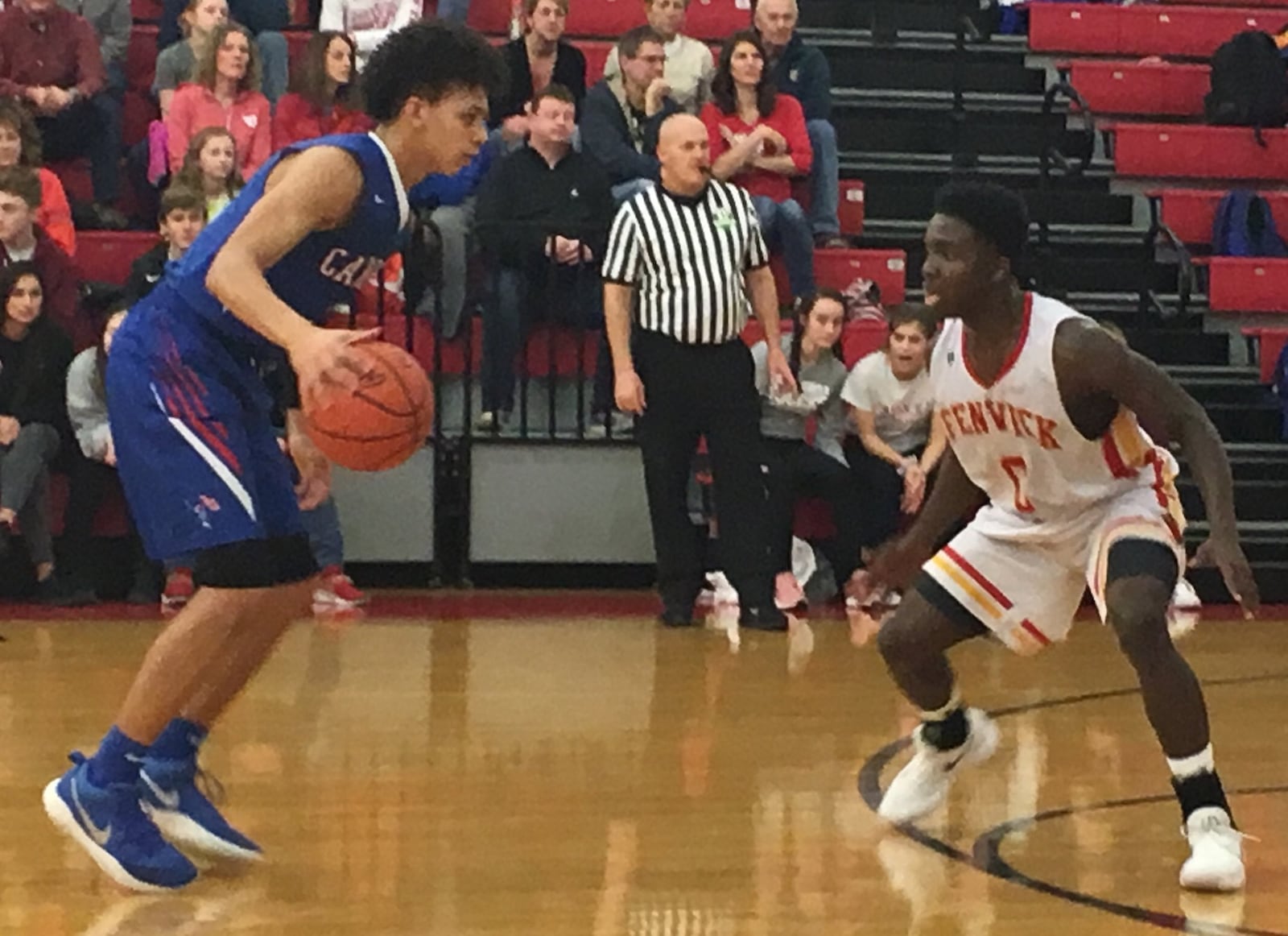 Fenwick’s Calbe Davis keeps an eye on Eli Ramsey of Carroll on Saturday night at Fenwick. RICK CASSANO/STAFF