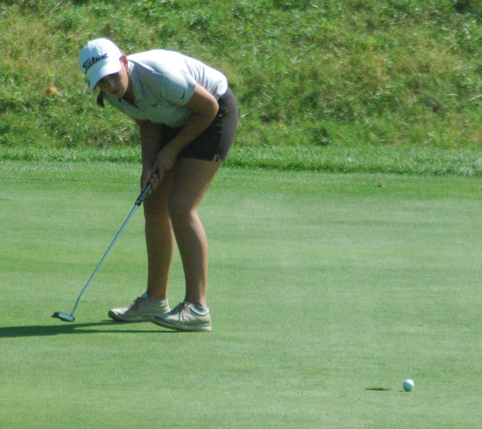 Lakota East’s Ellie Yeazell reacts after a missing a putt on the 18th green Monday during the Division I sectional girls golf tournament at Walden Ponds Golf Club in Fairfield Township. RICK CASSANO/STAFF