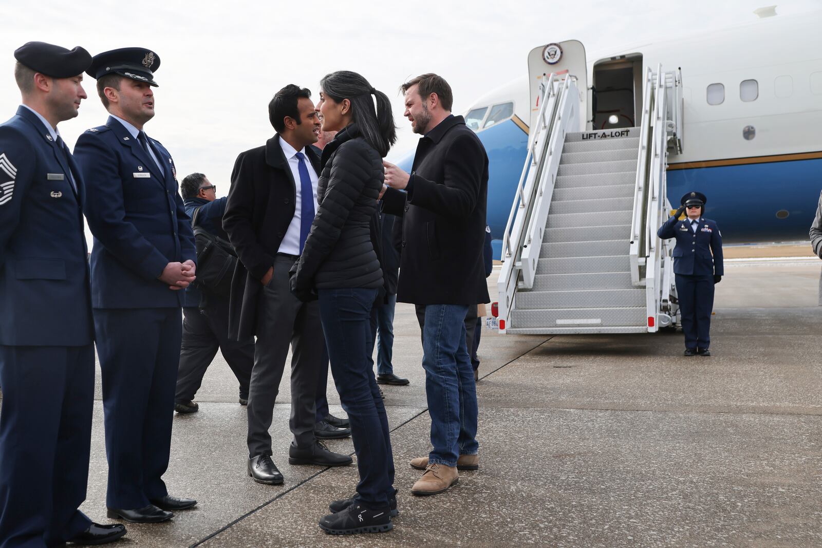 Vice President JD Vance, center, speaks with Vivek Ramaswamy as Vance and his wife Usha Vance arrive at Youngstown Air Reserve Station in Vienna, Ohio, en route to East Palestine, Ohio, Monday, Feb. 3, 2025. (Rebecca Droke/Pool Photo via AP