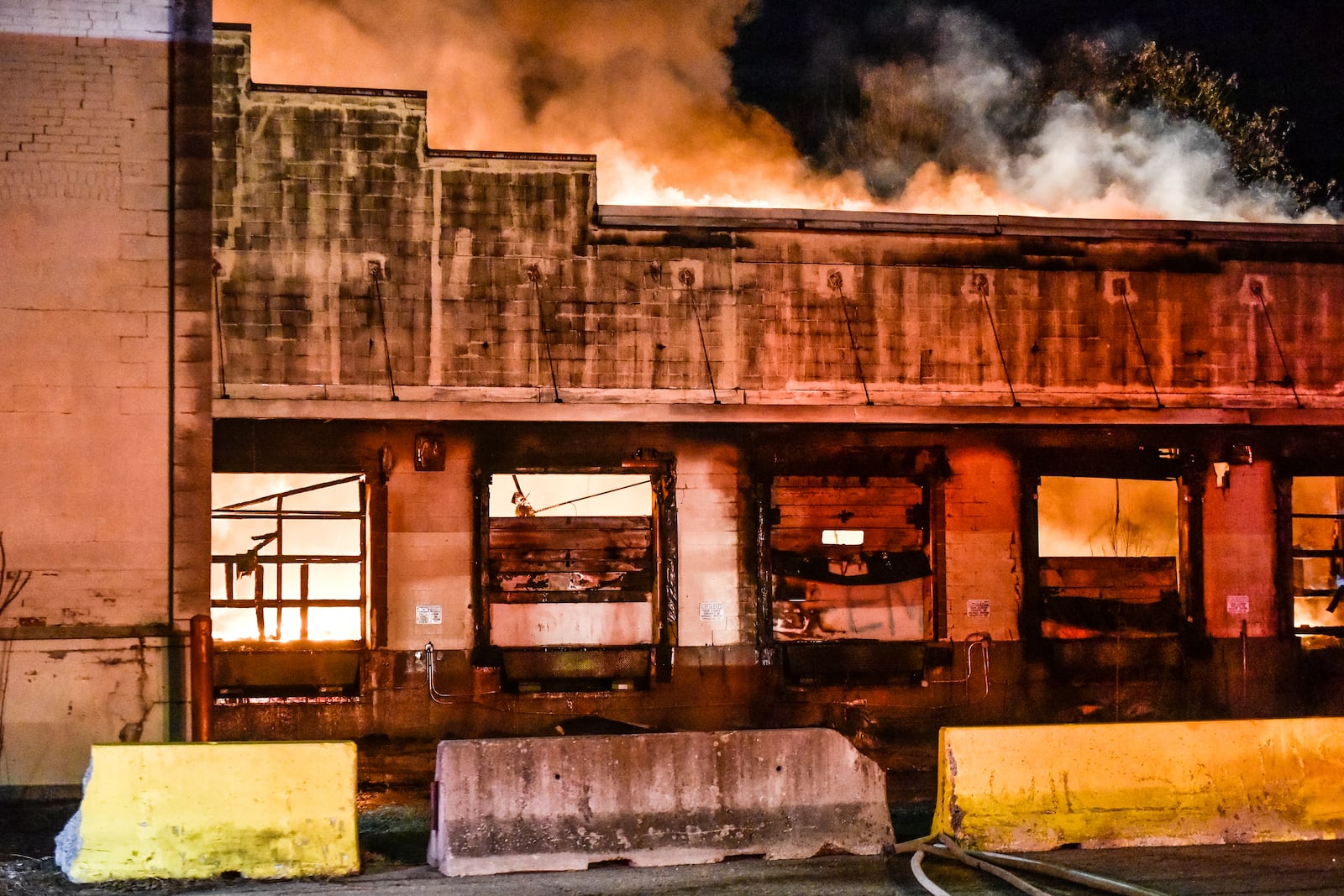 Fire crews from multiple departments battle a fire in the former Middletown Paperboard building on Verity Parkway Friday, Feb. 2 in Middletown. NICK GRAHAM/STAFF