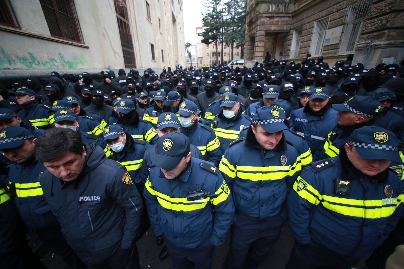 Police block a street during a rally to demand new parliamentary elections in the country, near the Parliament's building in Tbilisi, Georgia, Monday, Nov. 25, 2024. (AP Photo/Zurab Tsertsvadze)