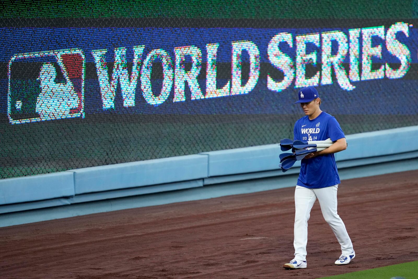 Los Angeles Dodgers pitcher Yoshinobu Yamamoto arrives during batting practice during media day for the baseball World Series against the New York Yankees, Thursday, Oct. 24, 2024, in Los Angeles. (AP Photo/Ashley Landis)