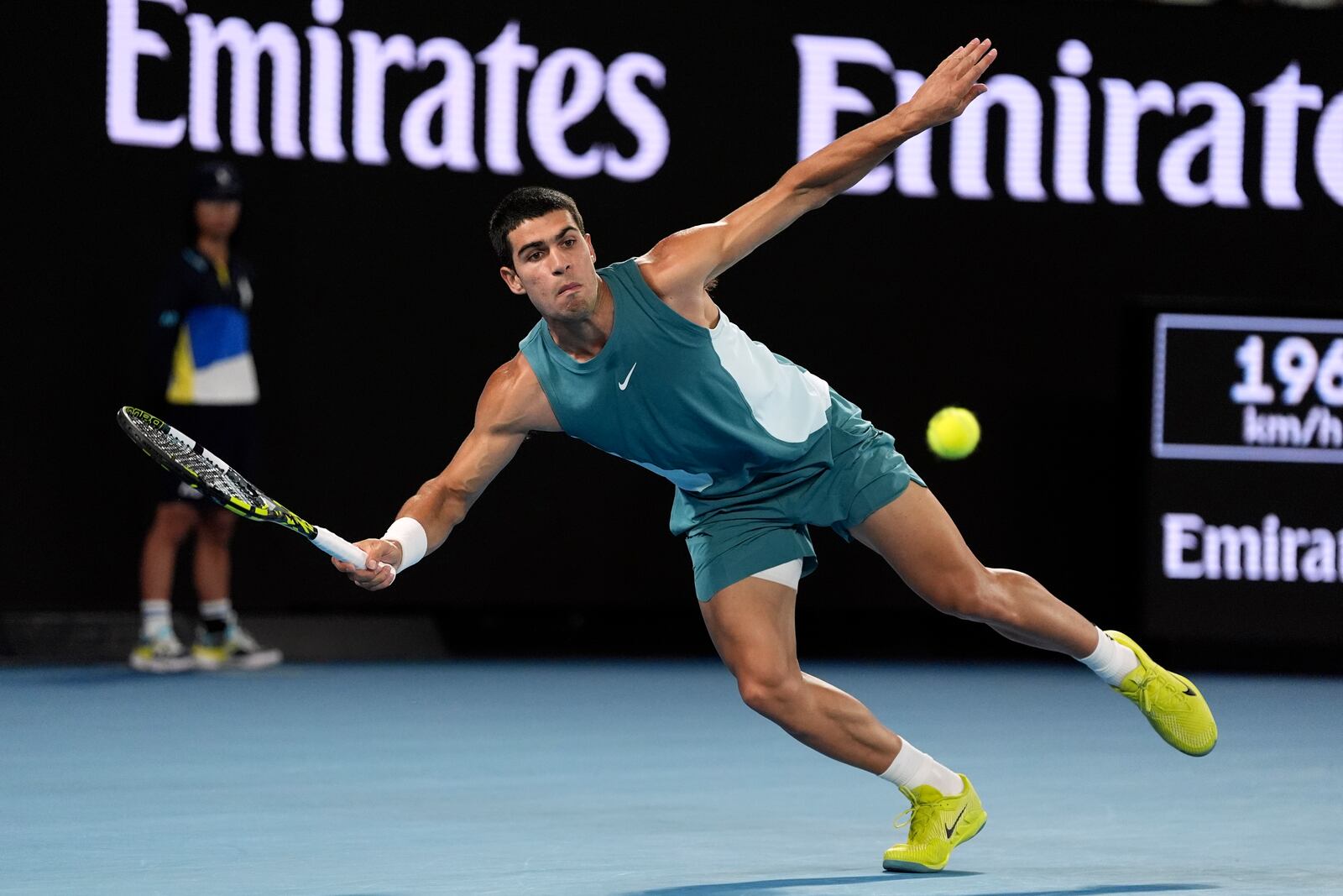 Carlos Alcaraz of Spain plays a forehand return to Novak Djokovic of Serbia during their quarterfinal match at the Australian Open tennis championship in Melbourne, Australia, Tuesday, Jan. 21, 2025. (AP Photo/Ng Han Guan)